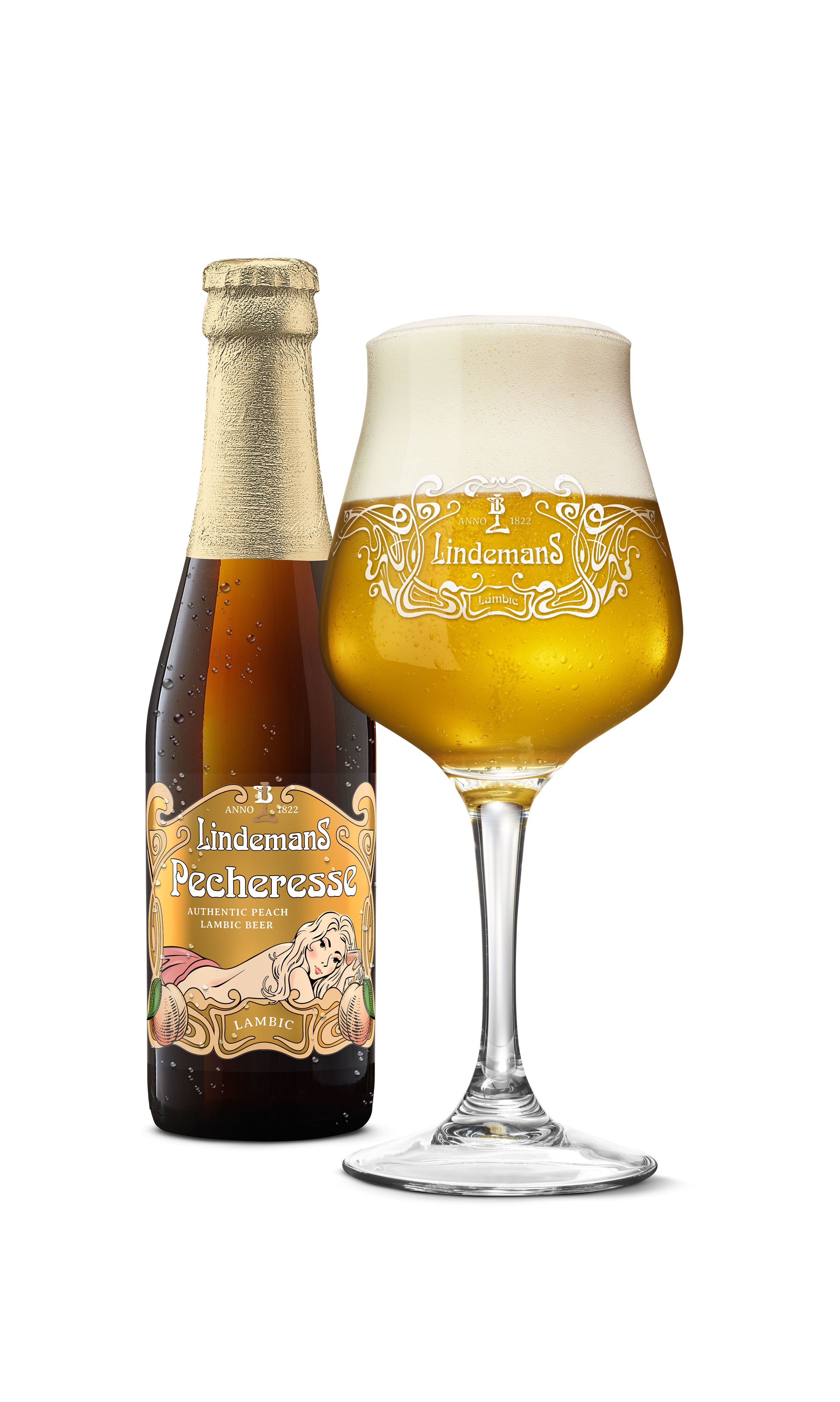 A bottle of Lindemans Pecheresse Lambic Beer with a vintage-style label and a Lindemans branded glass filled with Lindemans Pecheresse Lambic beer beside it.