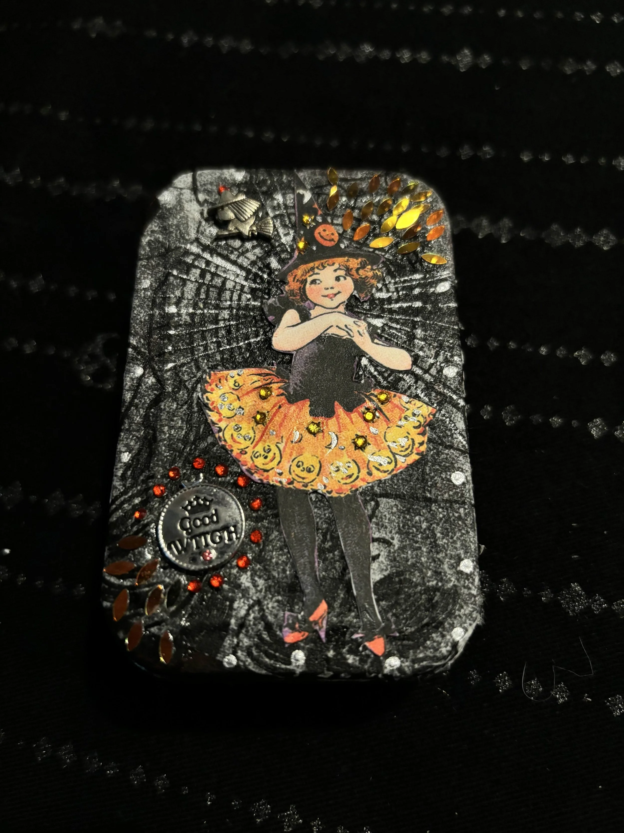 purple tin with little witch 1.jpg