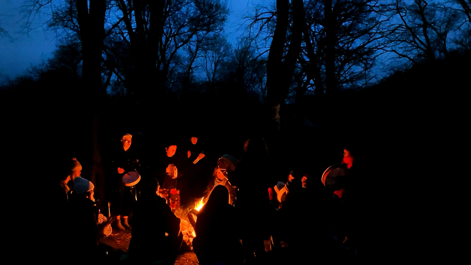somatic healing for women in nature around fire with breath and movement