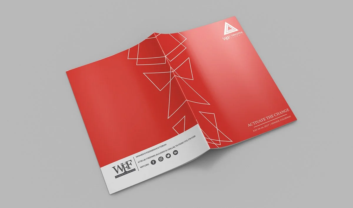 Open brochure with red cover and geometric white lines, featuring event details and logo for Women's Foodservice Forum.