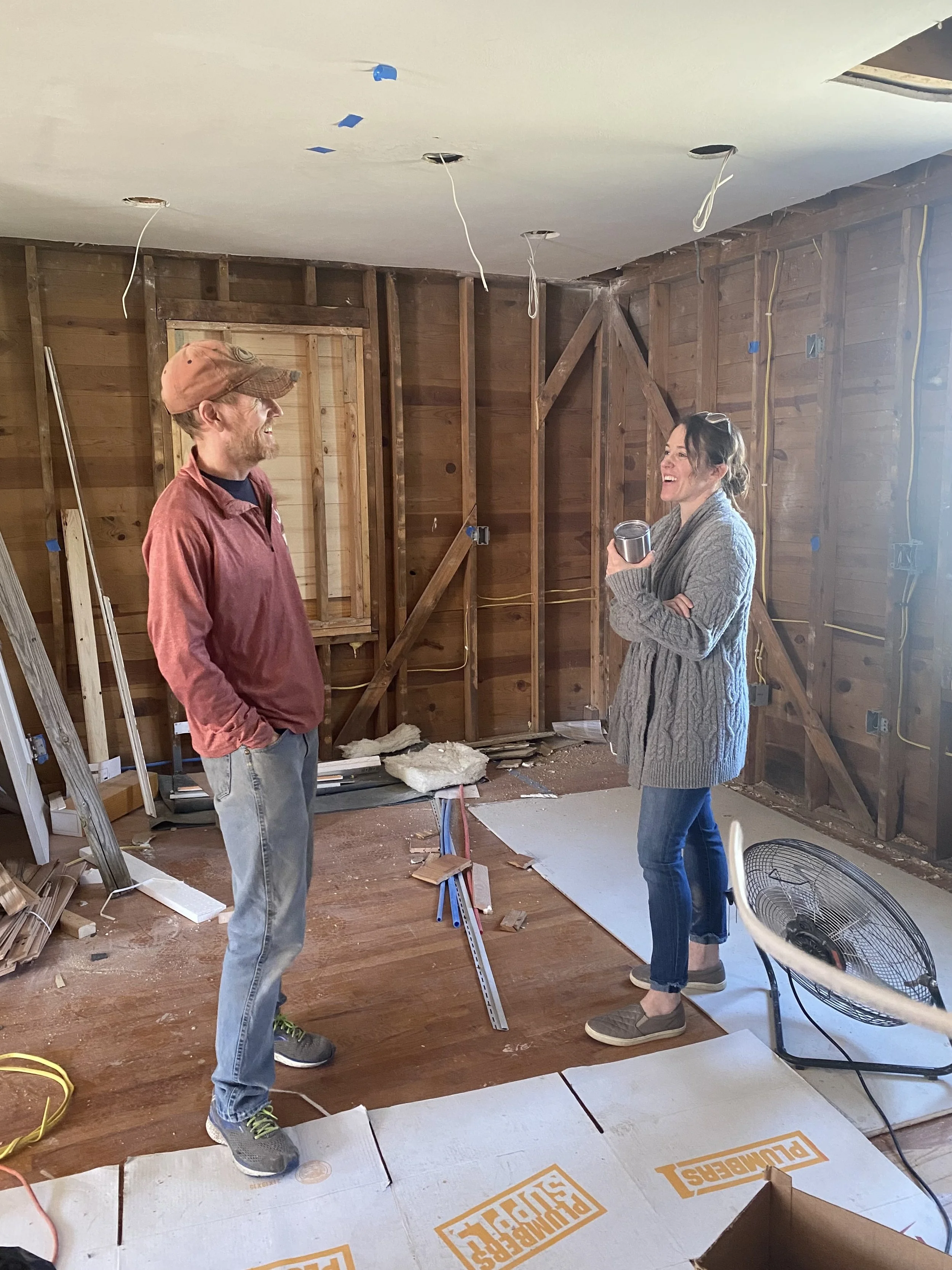 Megan talking with a coaching client mid-project renovation