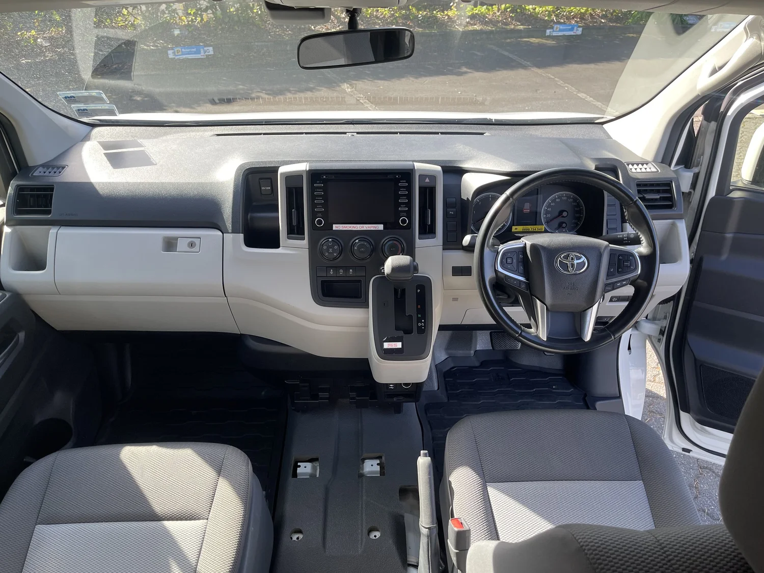 Toyota Hiace cab, dashboard, steering wheel and front seats