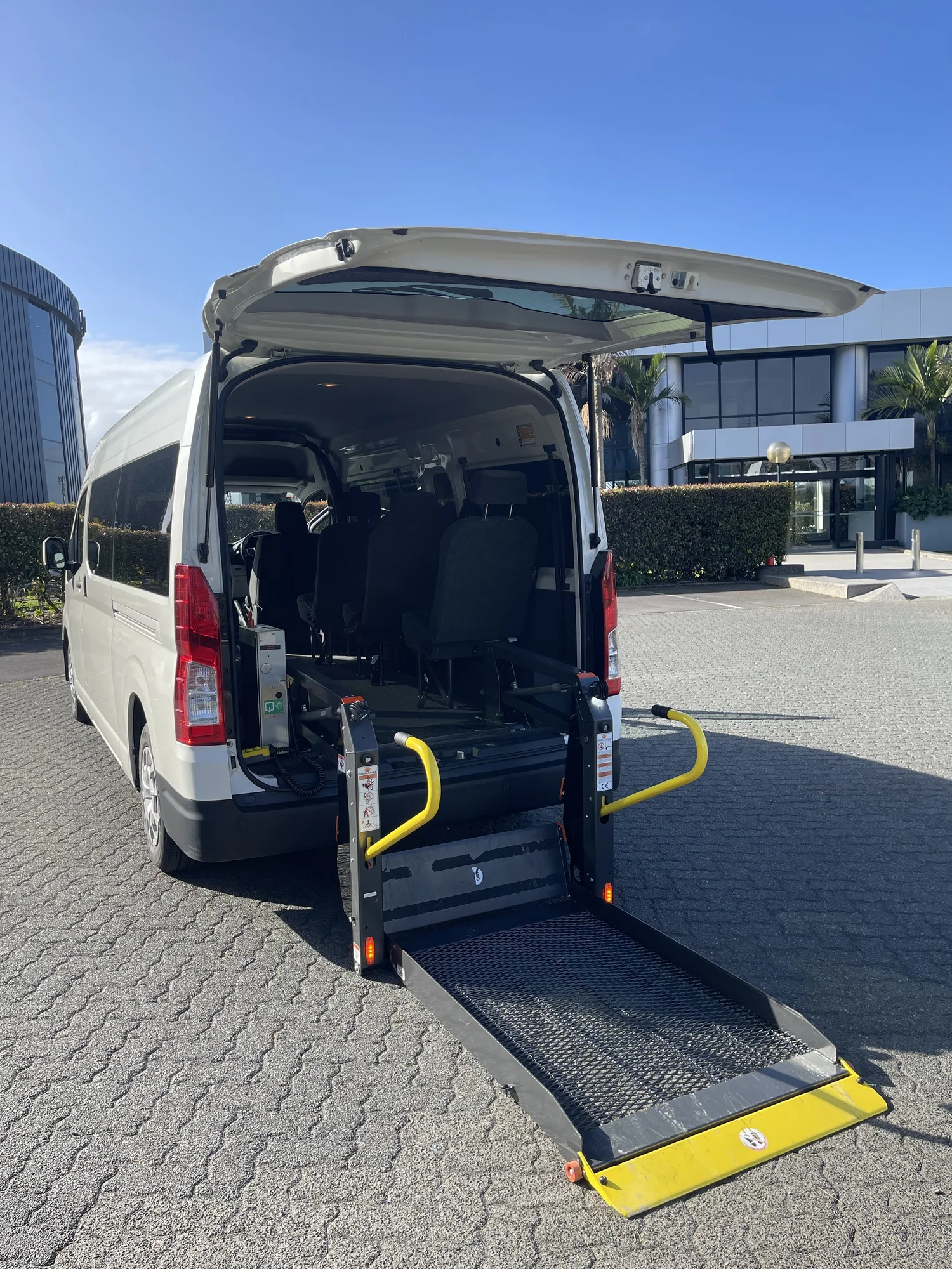 Toyota Hiace with rear doors open and powered hoist lowered