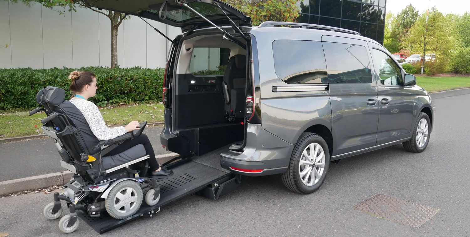 Power chair user boarding the Avance via the rear ramp