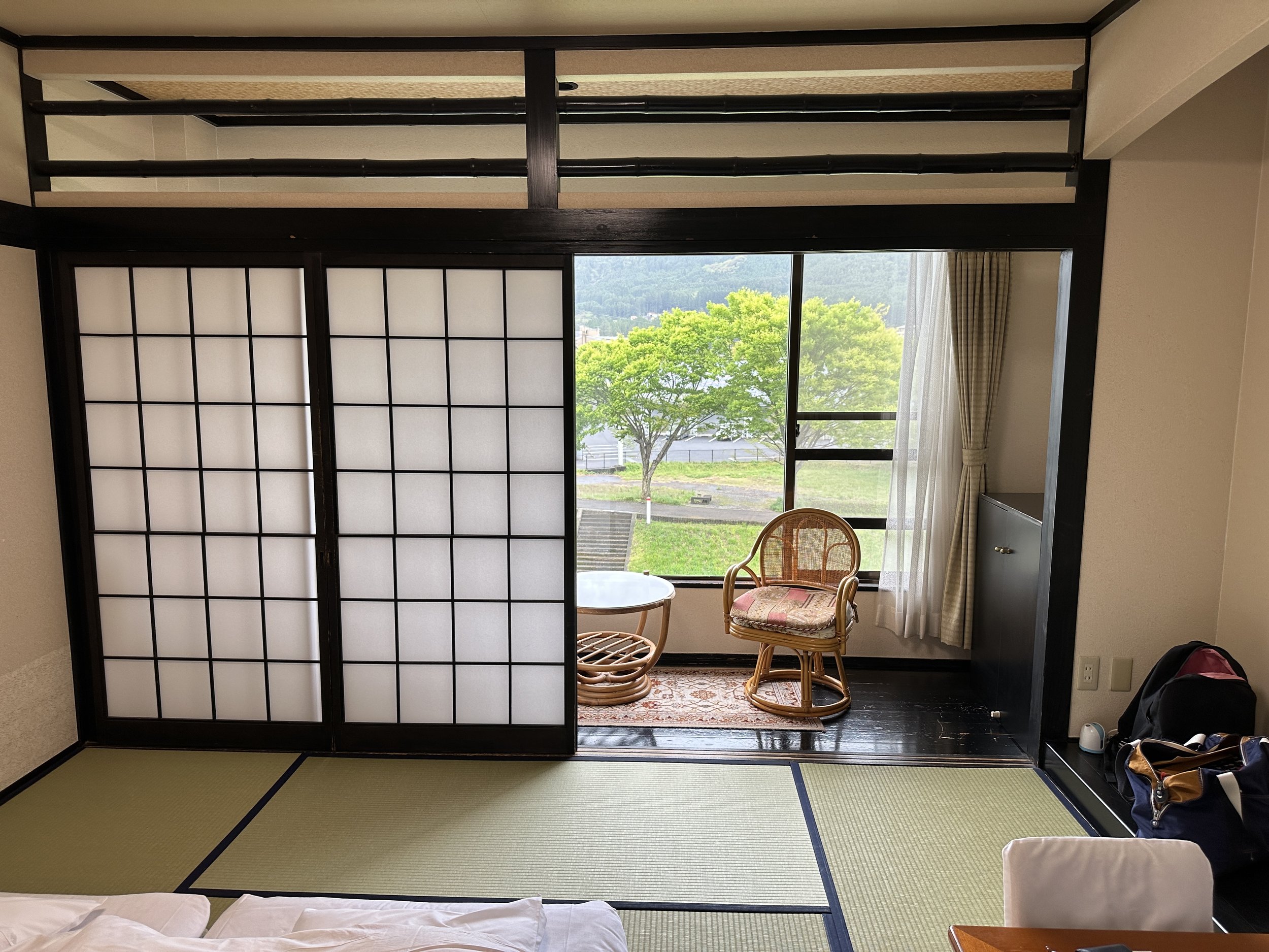 ryokan room with chabudai zabuton tatami mats shoji