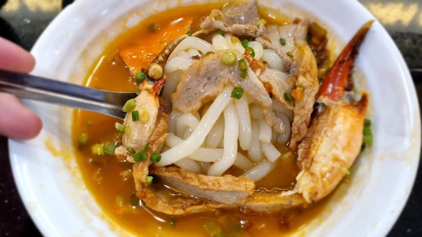 Street food in Ho Chi Minh City banh canh cua crab and shrimp noodle soup