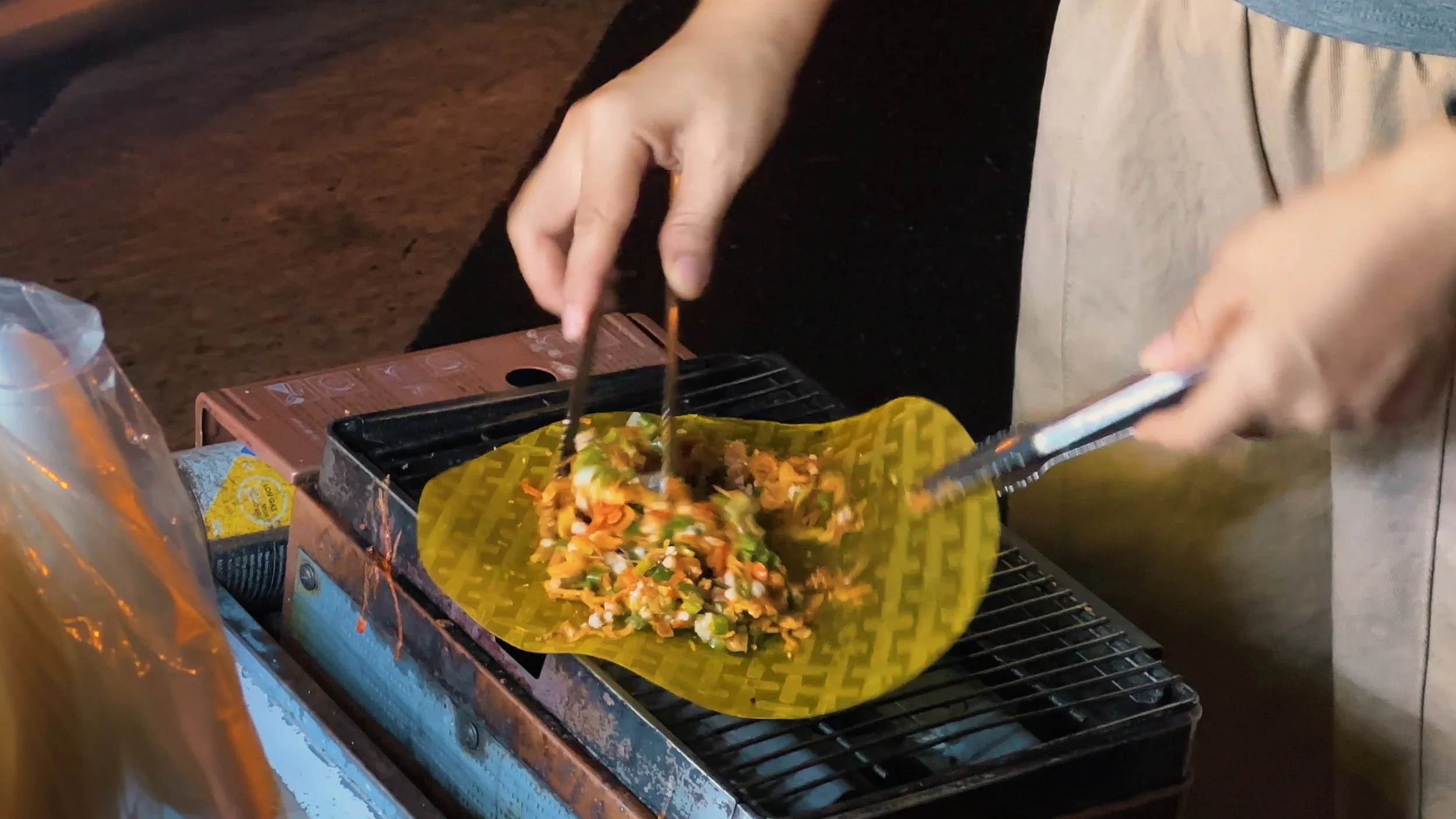 Street food in Ho Chi Minh City vietnamese pizza banh trang nuong