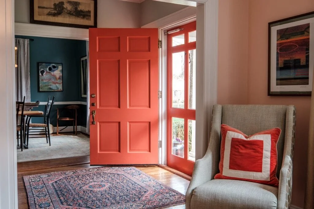 orange color front door and entryway from cat french design