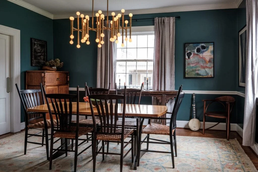 Colorful dining room with artistic chandelier from Cat French Design