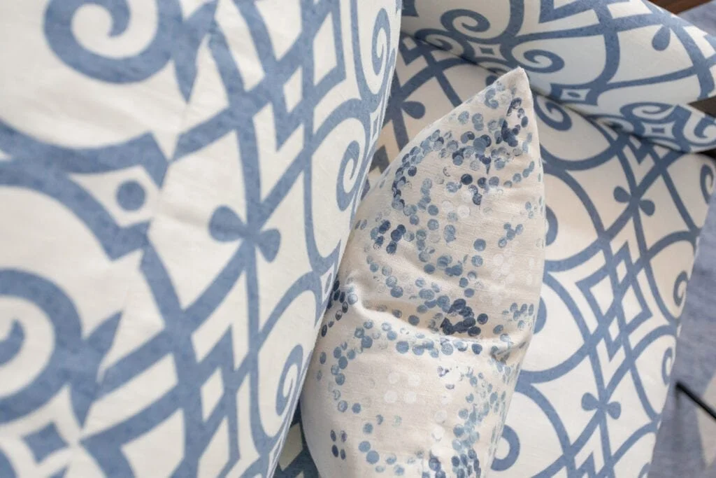 blue and white patterned custom armchair coastal inspired living room design durham north carolina by cat french durham interior designer