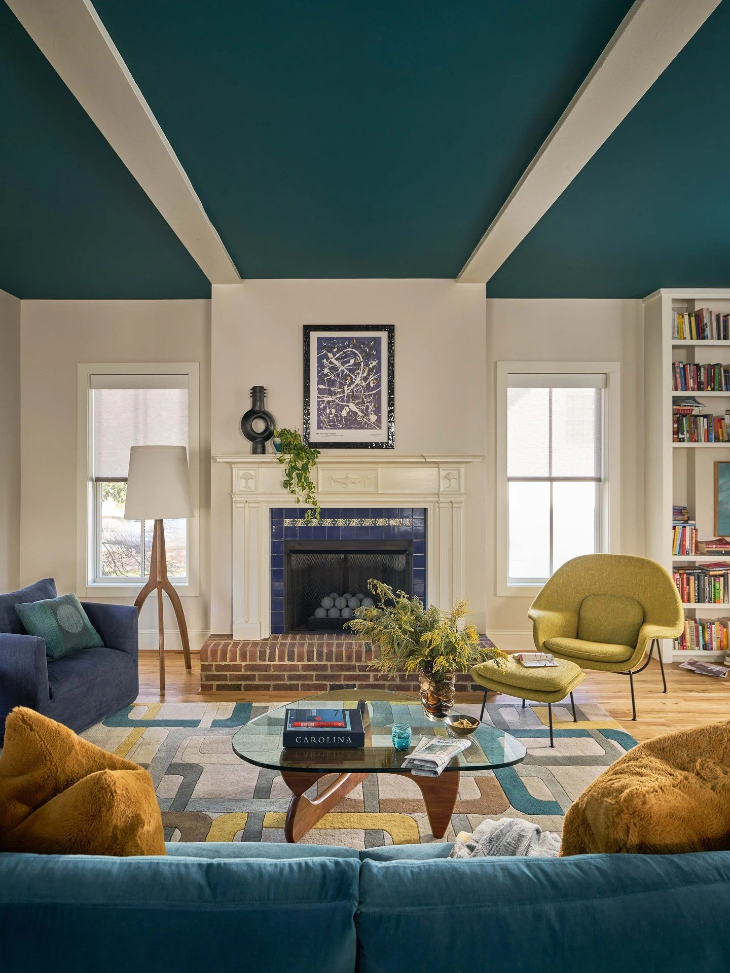 ALLL the joyful vibes here ✨️ Shape, pattern, texture. Mid-century soul, but with vibrance.  Books tucked-in everywhere.  And, the magic of a rich teal ceiling 🔥 😍⁠
⁠
One of our goals with this house was to take this new build (call it a blank slat