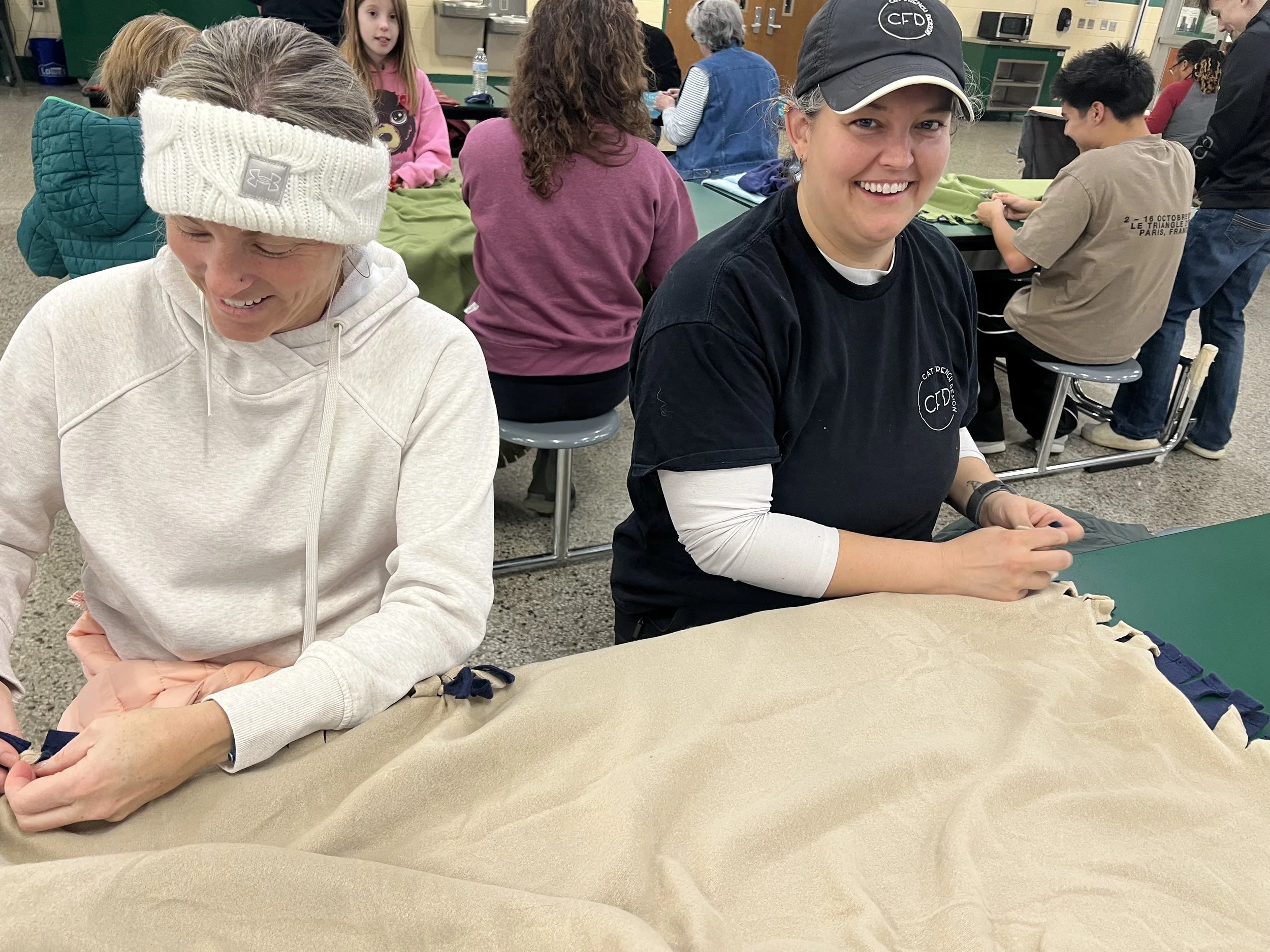 Cat French Design team members krista and kim making blankets for seniors in need with pittsboro rotary club community service day MLK day