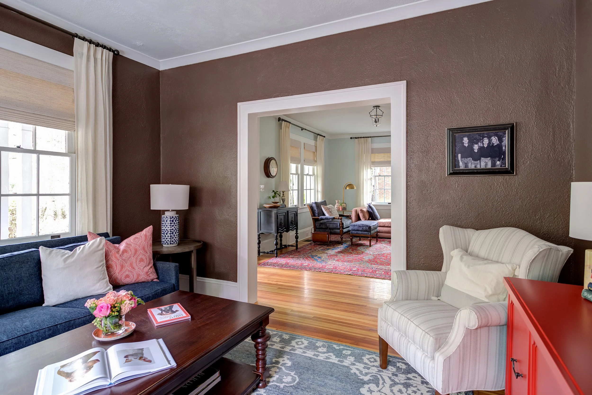 cozy living room with chocolate walls historic home interior design by cat french design chapel hill interior designer durham interior designer