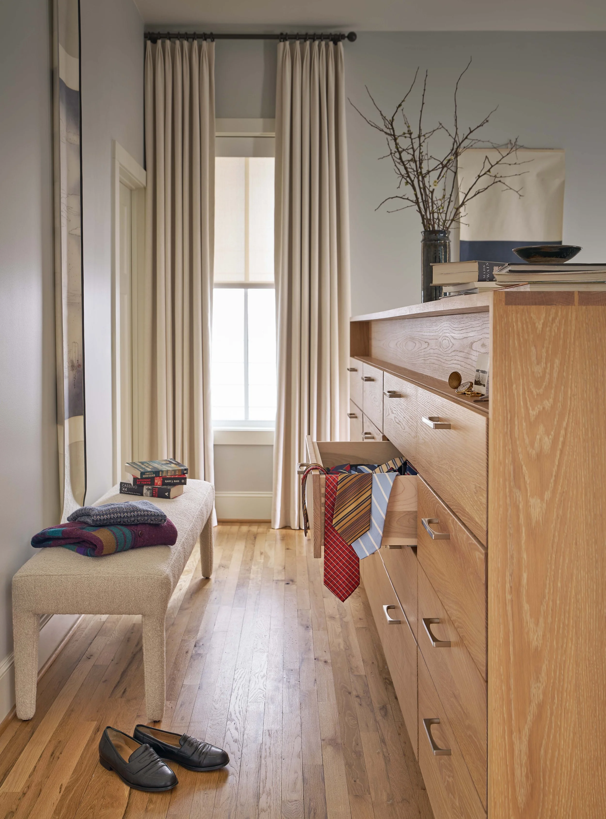 primary bedroom design with custom made bed with attached dresser in mid-century home design by cat french design comfortable luxury interior design interior design chapel hill