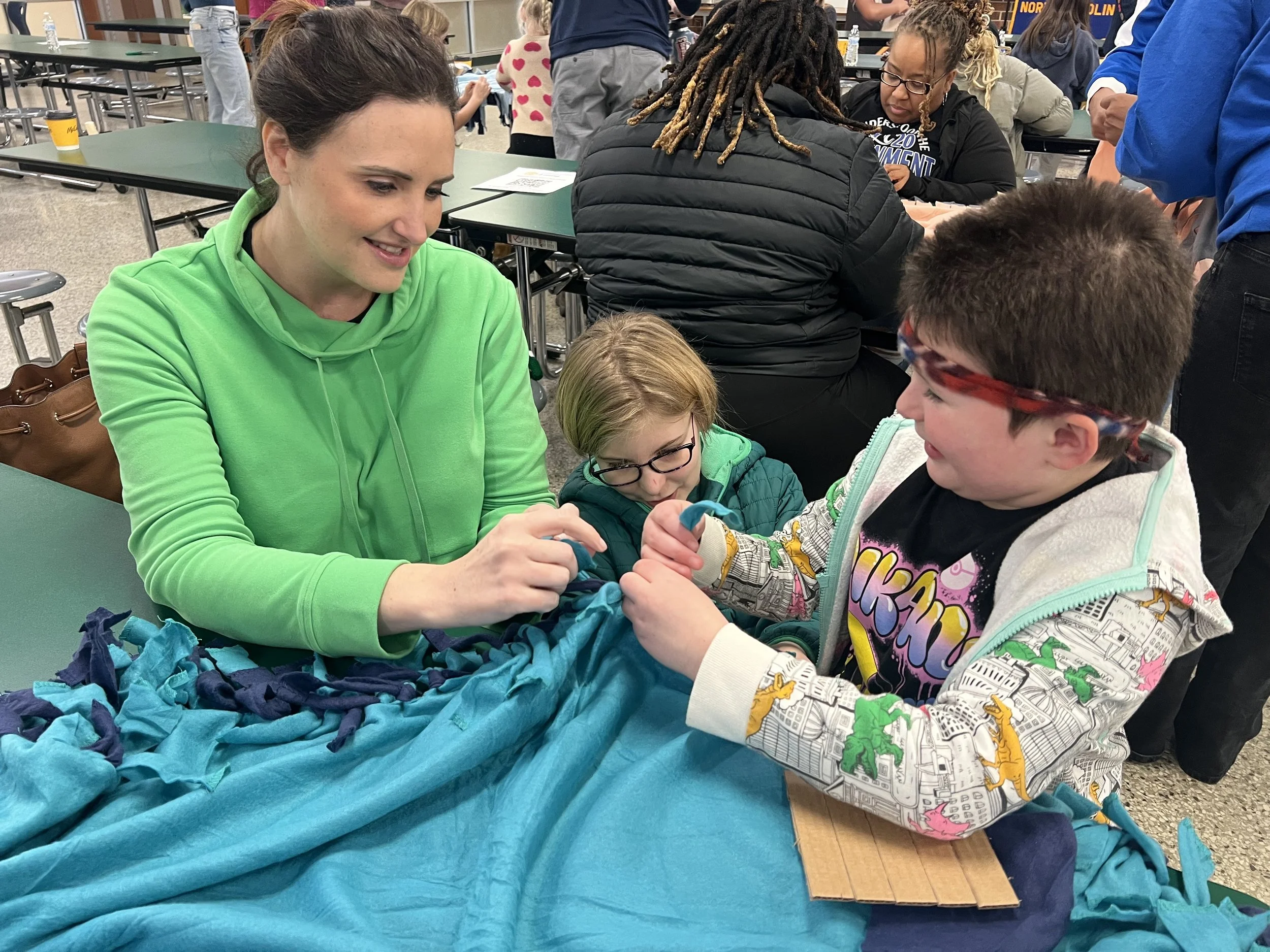 Lead interior designer rebecca at cat french design service day making blankets for seniors in need in chatham county
