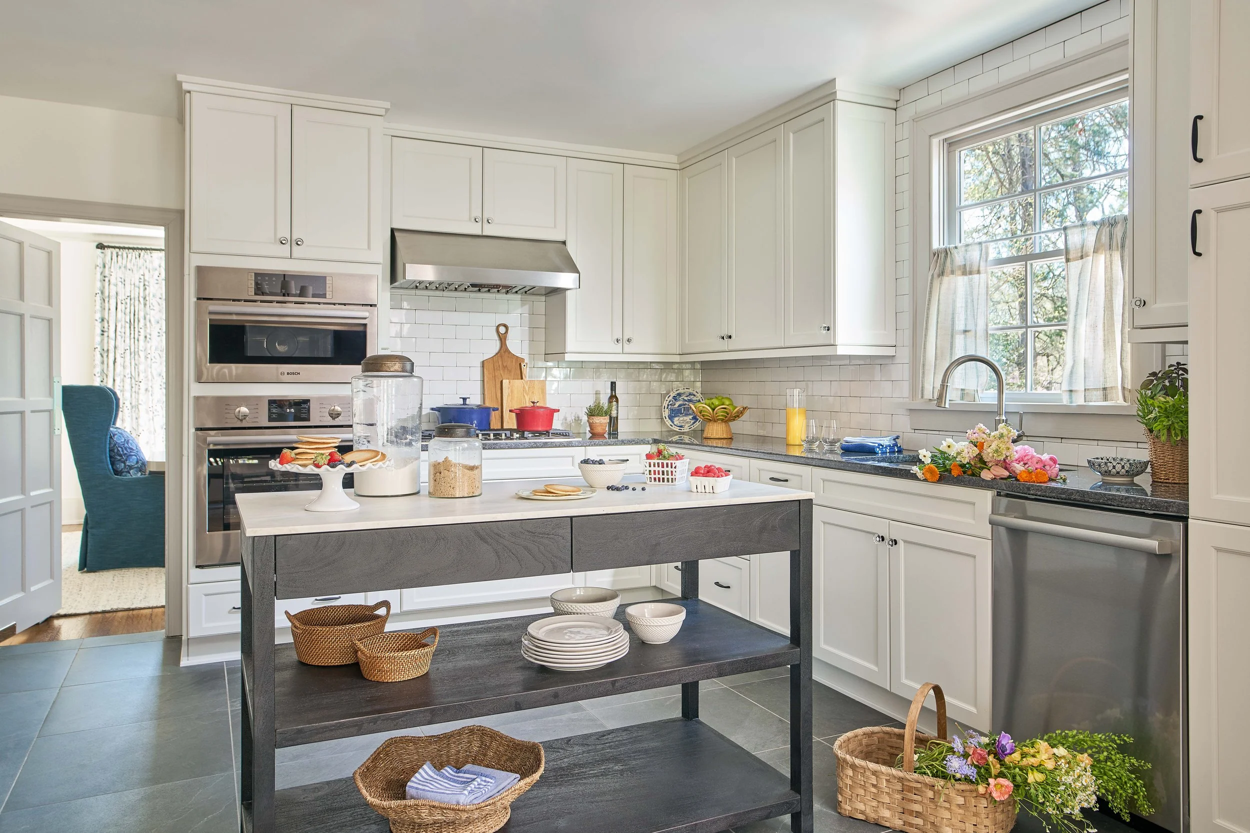 white kitchen with large kitchen island renovated and designed by cat french design chapel hill interior designer durham interior designer
