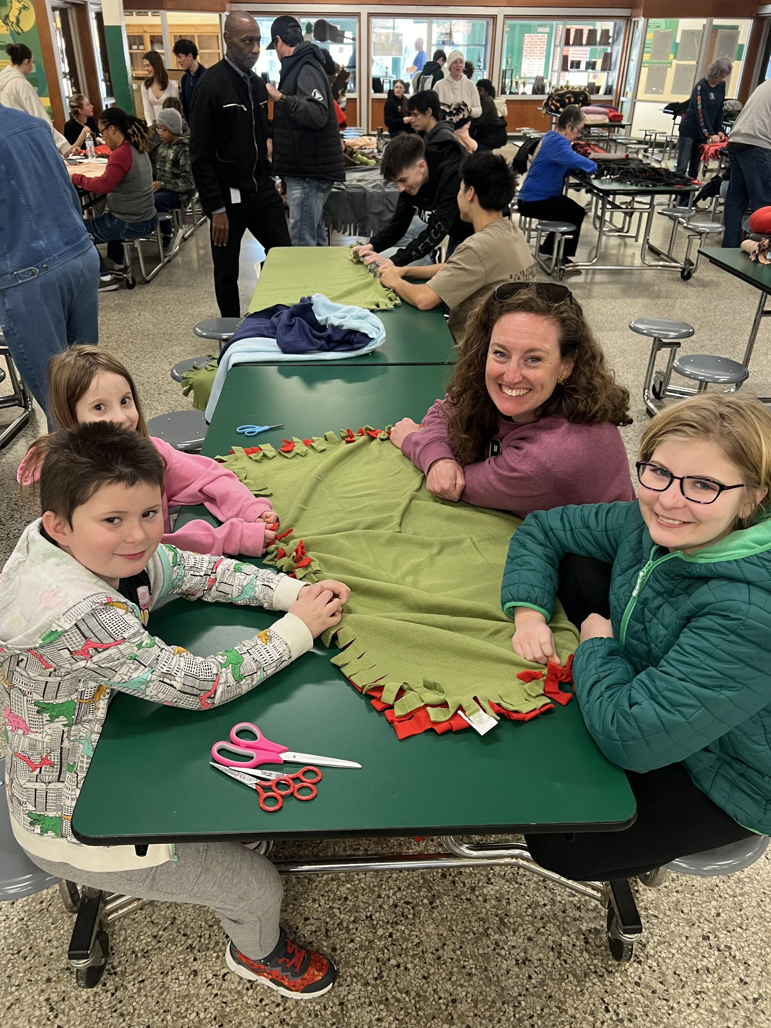 Chapel Hill Interior designer cat french and team at a service day making blankets for chatham county residents in need