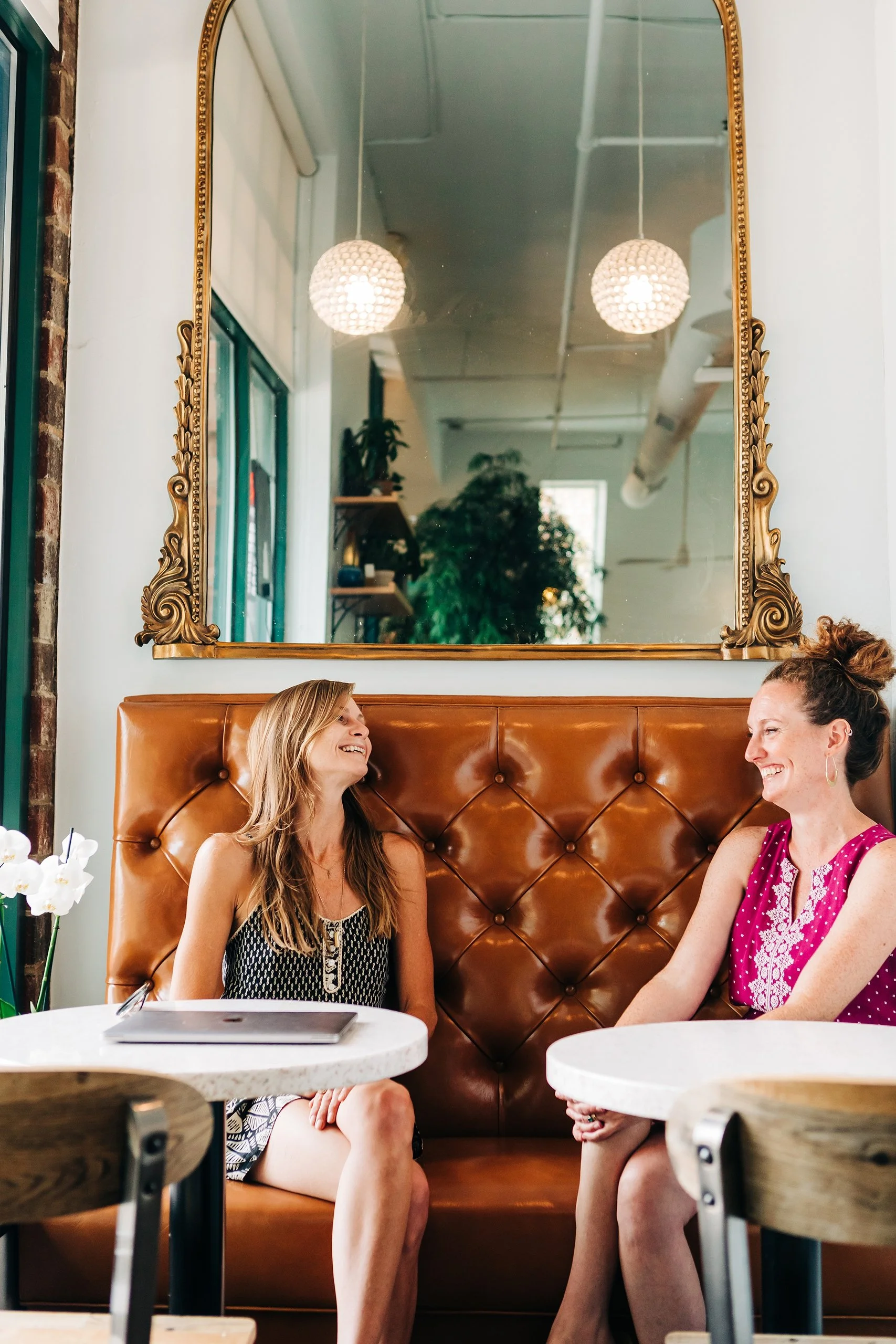 interior designer cat french sitting with la vita dolce cafe owner annie johnston chapel hill interior designer durham interior designer