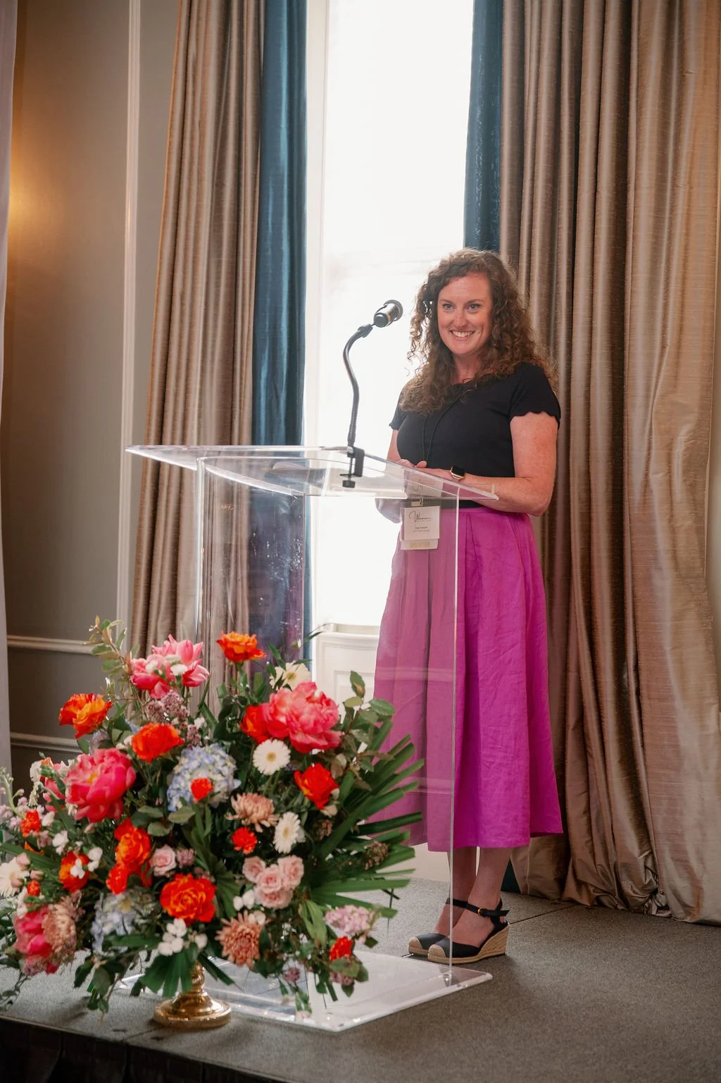 chapel hill interior designer cat french design on the podium at the chapel hill women of achievement ceremony