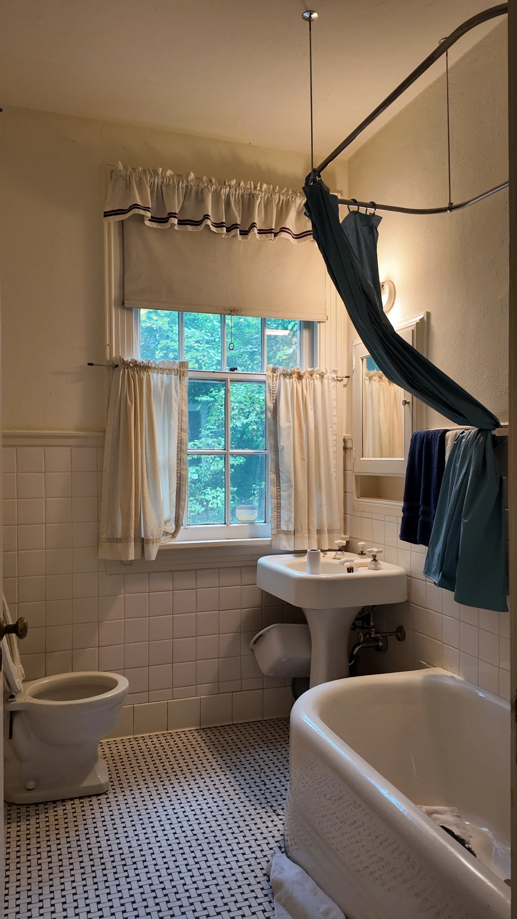 bathroom tub sink black and white floor tile in historic chapel hill home renovation