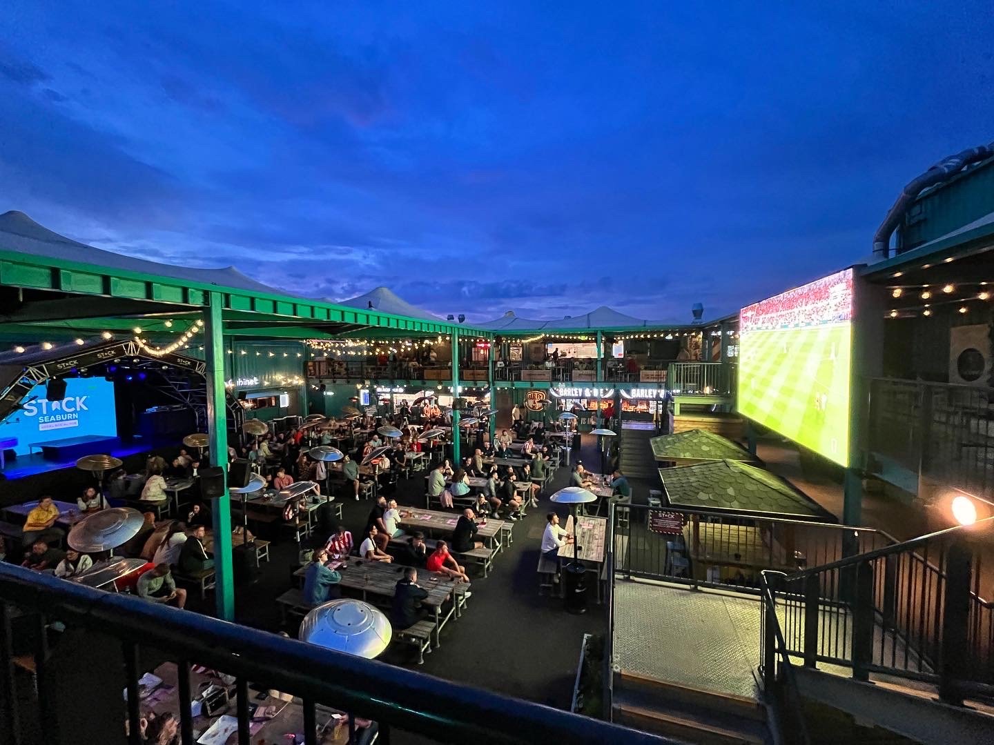 crowds watching football on LED Screen