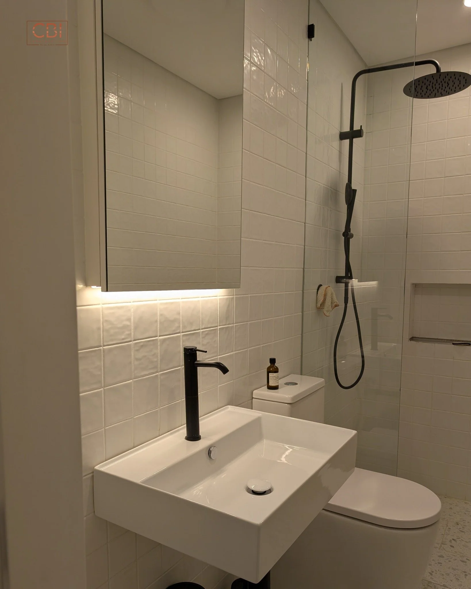 Proof that size doesn't matter! We packed modern style into this compact bathroom with bold black tapware, crisp white tiles, and smart lighting. Premium finish, no matter the size.

📞 0485 908 863
📧 sales@cbi.construction
Questionnaire: https://fo