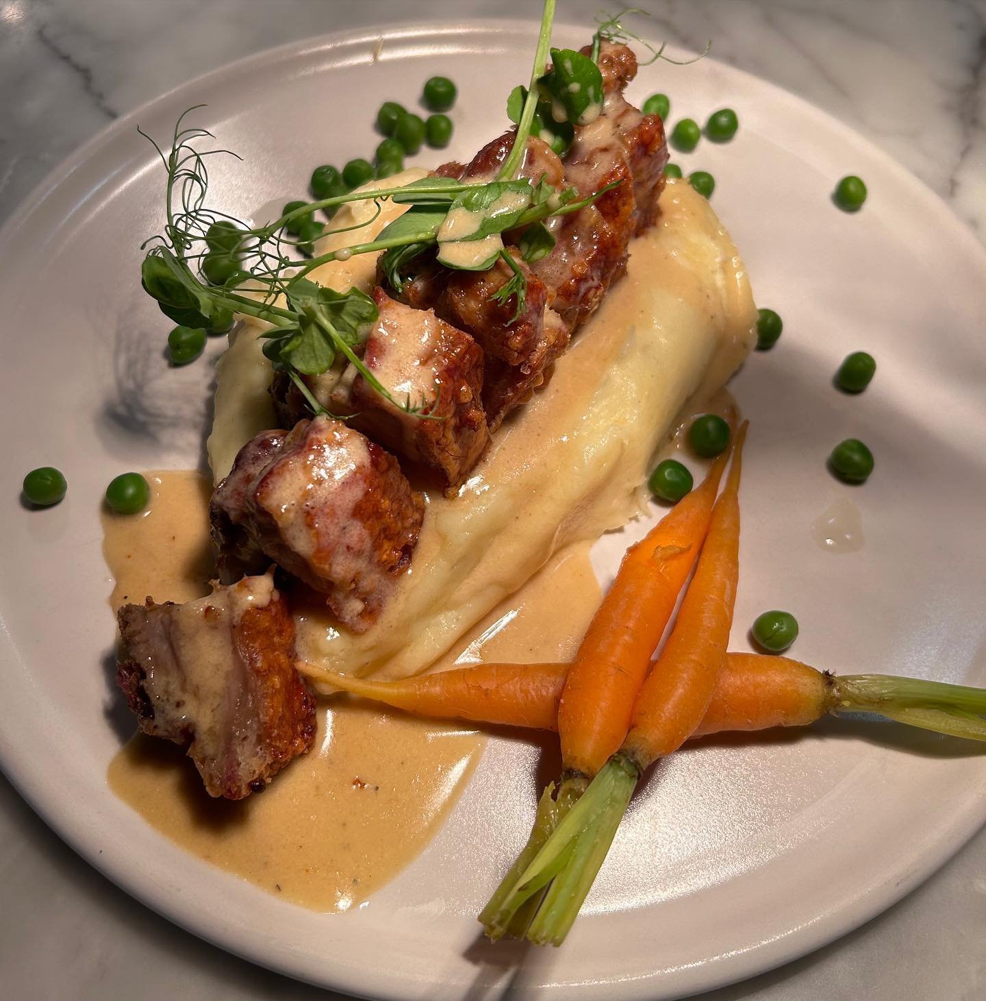 Spring Lunch Menu:

Crispy Belly Pork
Creamy Mash Potato, Baby Carrots, Garden Peas, Vermouth Jus

Join us for a delicious lunch at OKN1!

Book a table and view all our menus via the link in our bio🔗

#okn1 #lunch #meal #london #hoxton #hacnkey #res