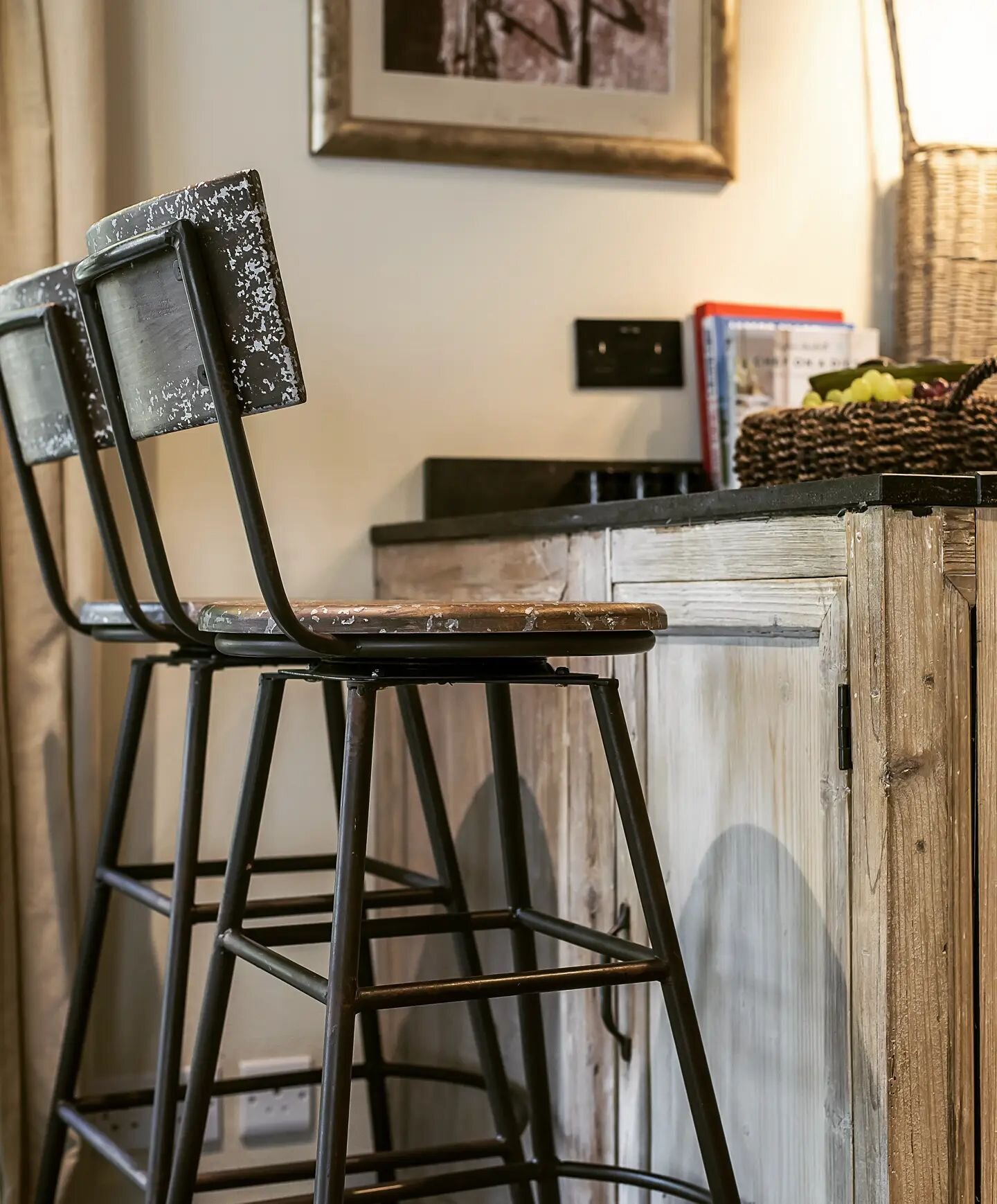 Bar stools are very handy. They don't take up a lot of room and yet offer very intimate seating and dining, or even just a quiet coffee, glass of wine with over a chat with the chef! 

I find that some are rather uncomfortable, but chosen well, with 