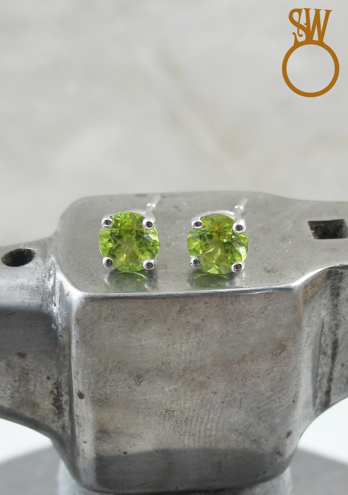 Wapping raffle prize peridot stud earrings 14ct white gold.jpg
