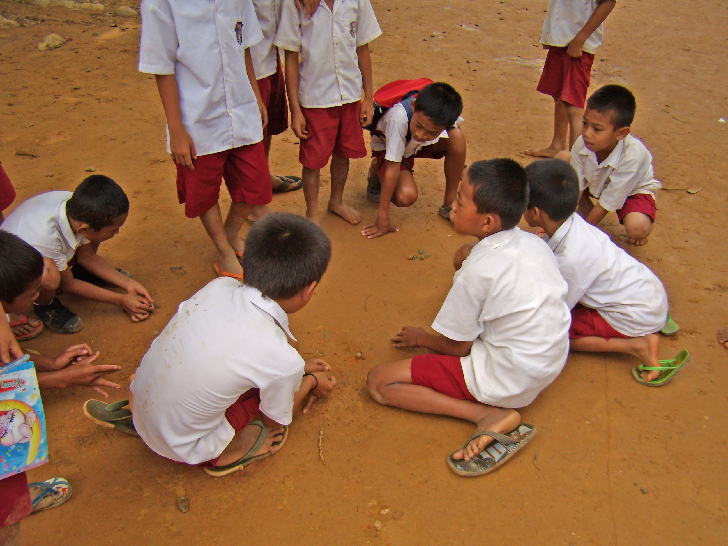 #15. Schoolboys playing marbles in Marante Village, Sulawesi. Photo credit: David F. Lancy.