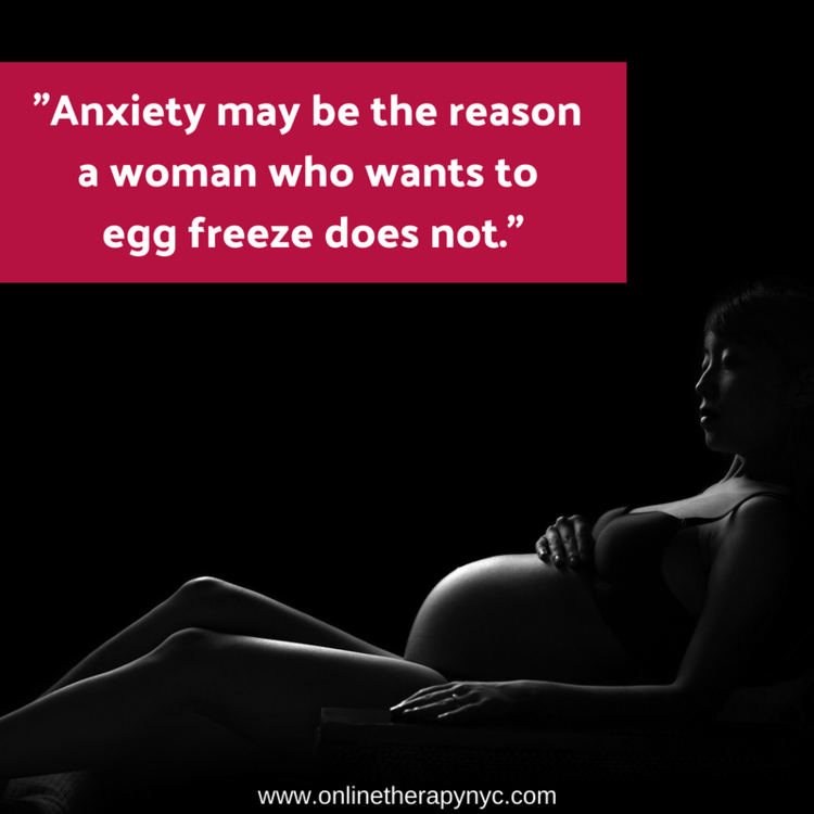 A pregnant woman resting her hands on her belly