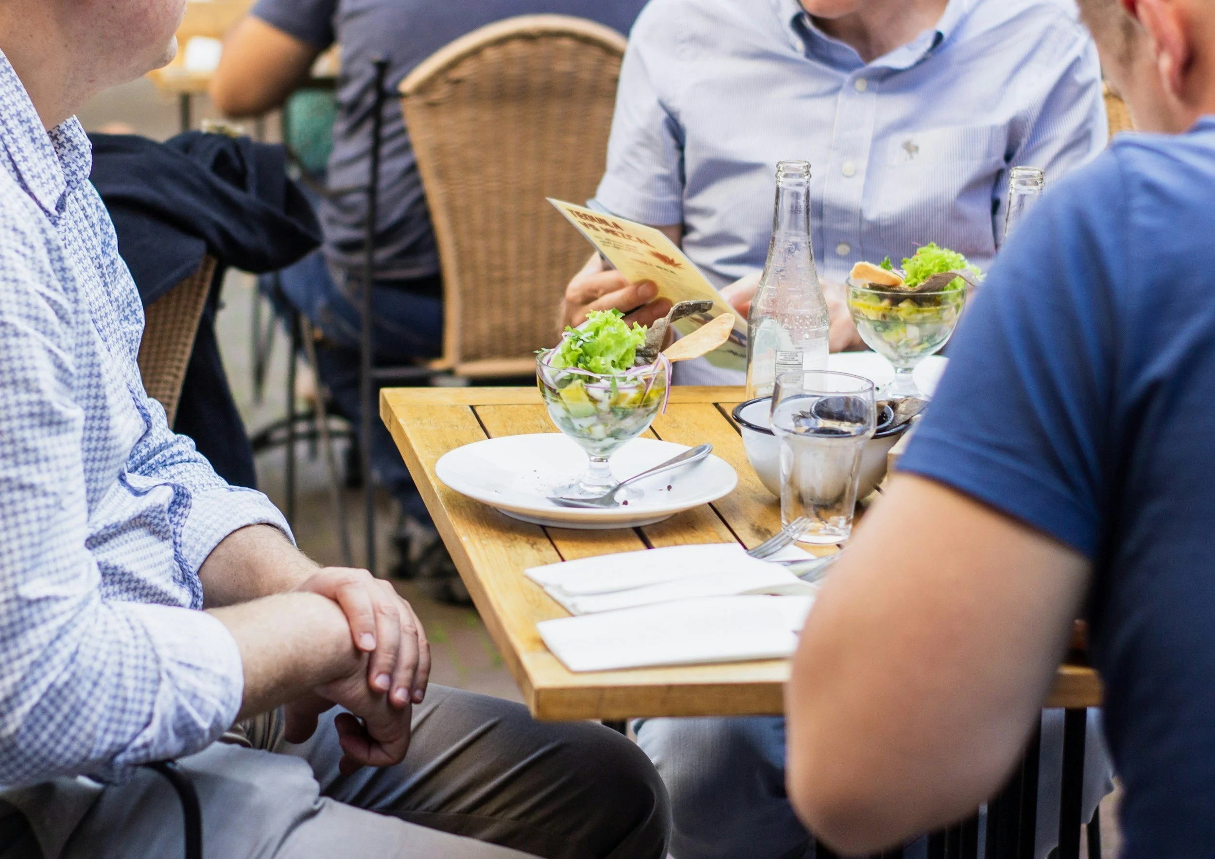 Professional colleagues eating lunch together at a restaurant