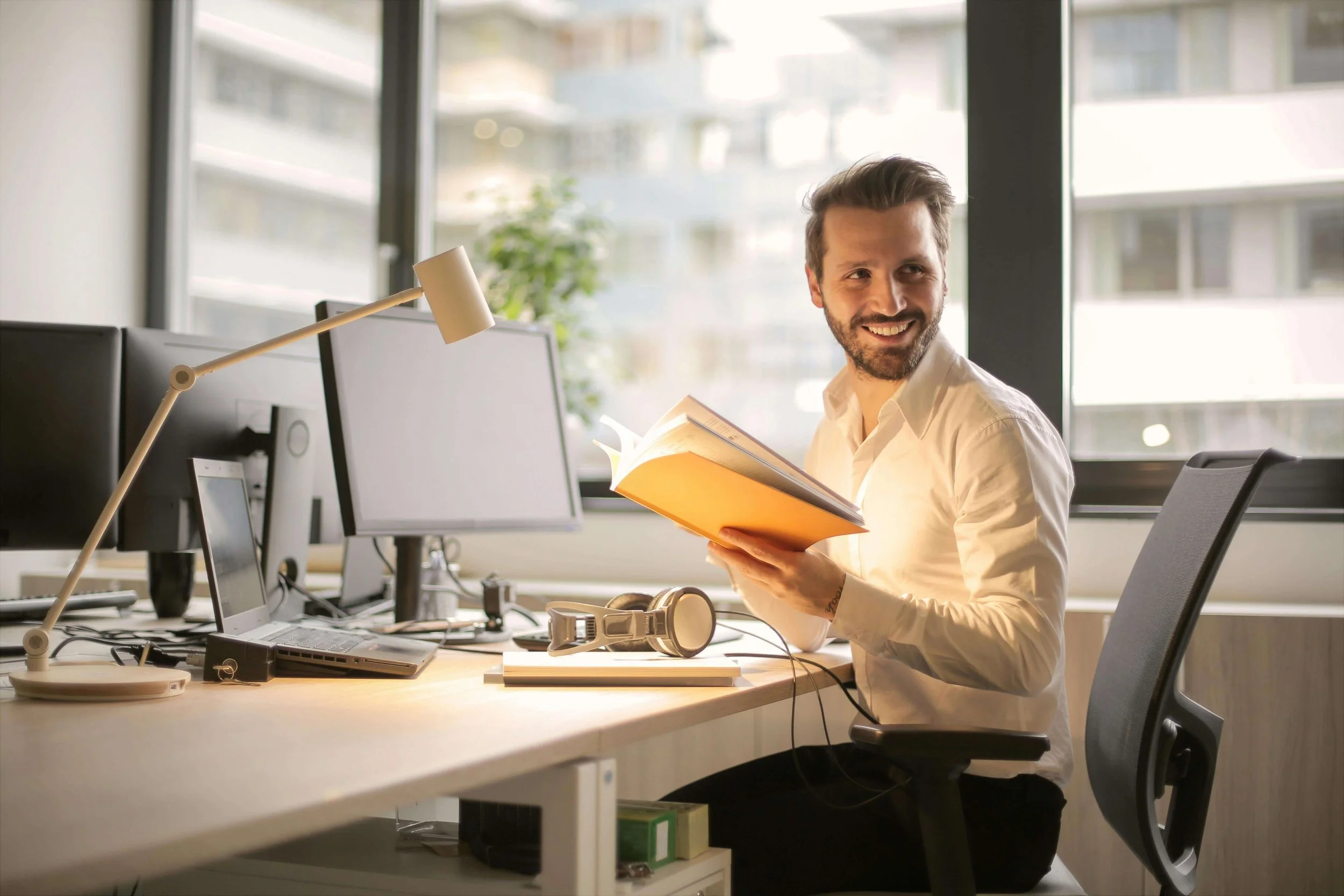 A man smiling in an office setting