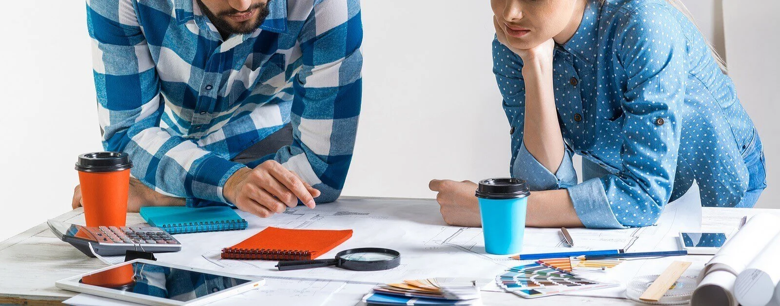 A man and a woman collaborating on a project together