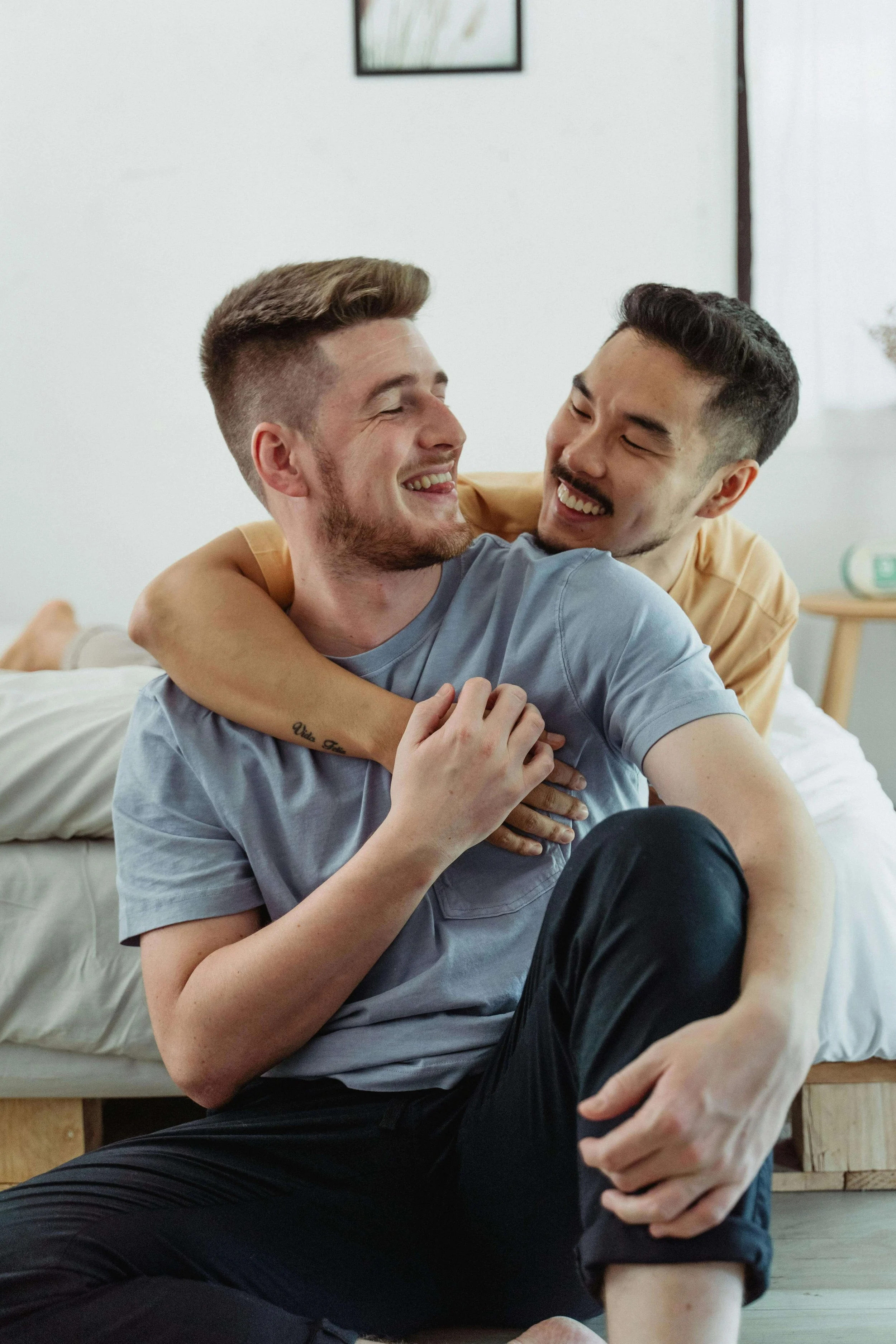 A couple smiling and embracing each other
