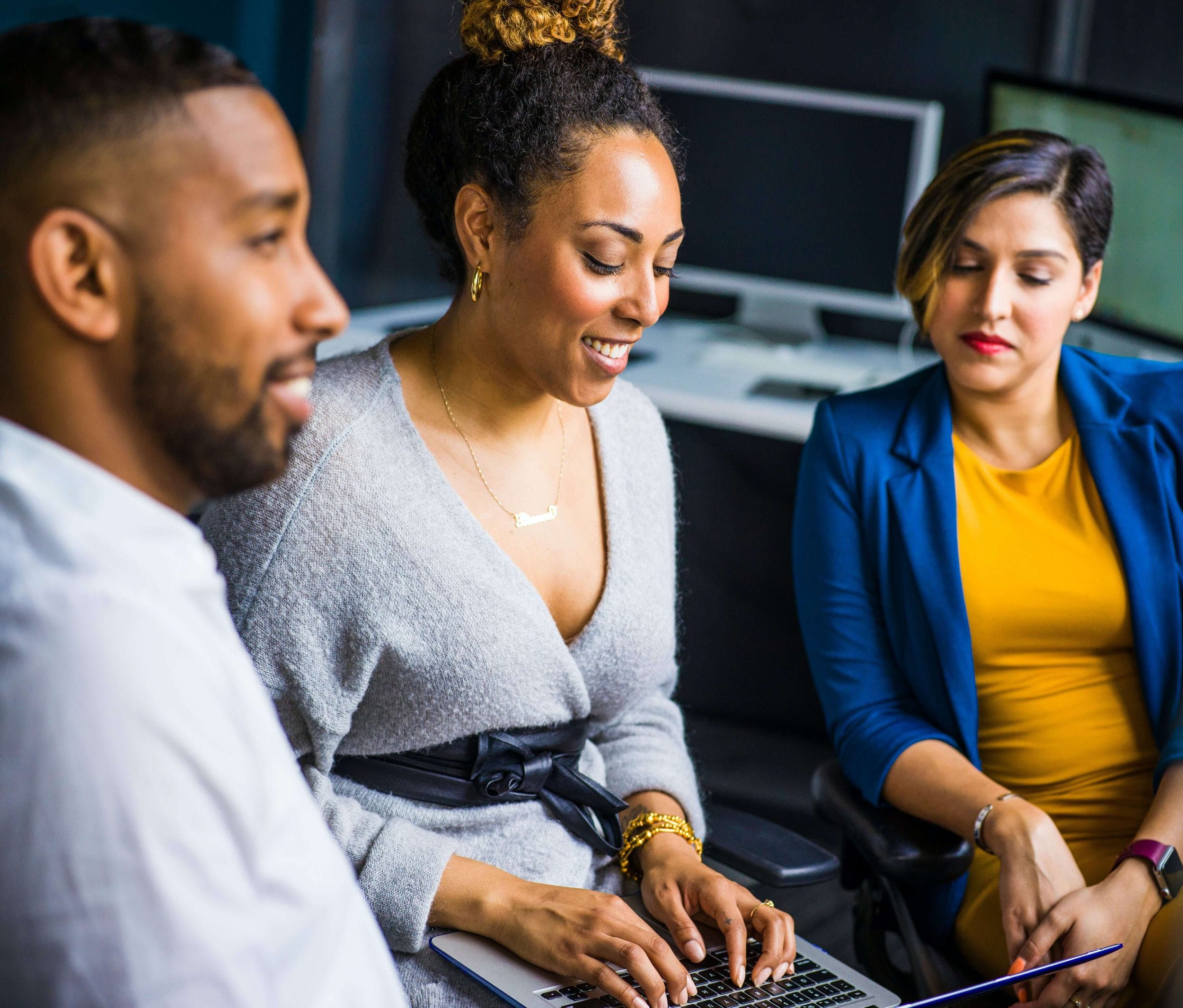 A group of people network and share resources despite networking anxiety. Therapy for Anxiety in New York can boost your confidence and networking skills.