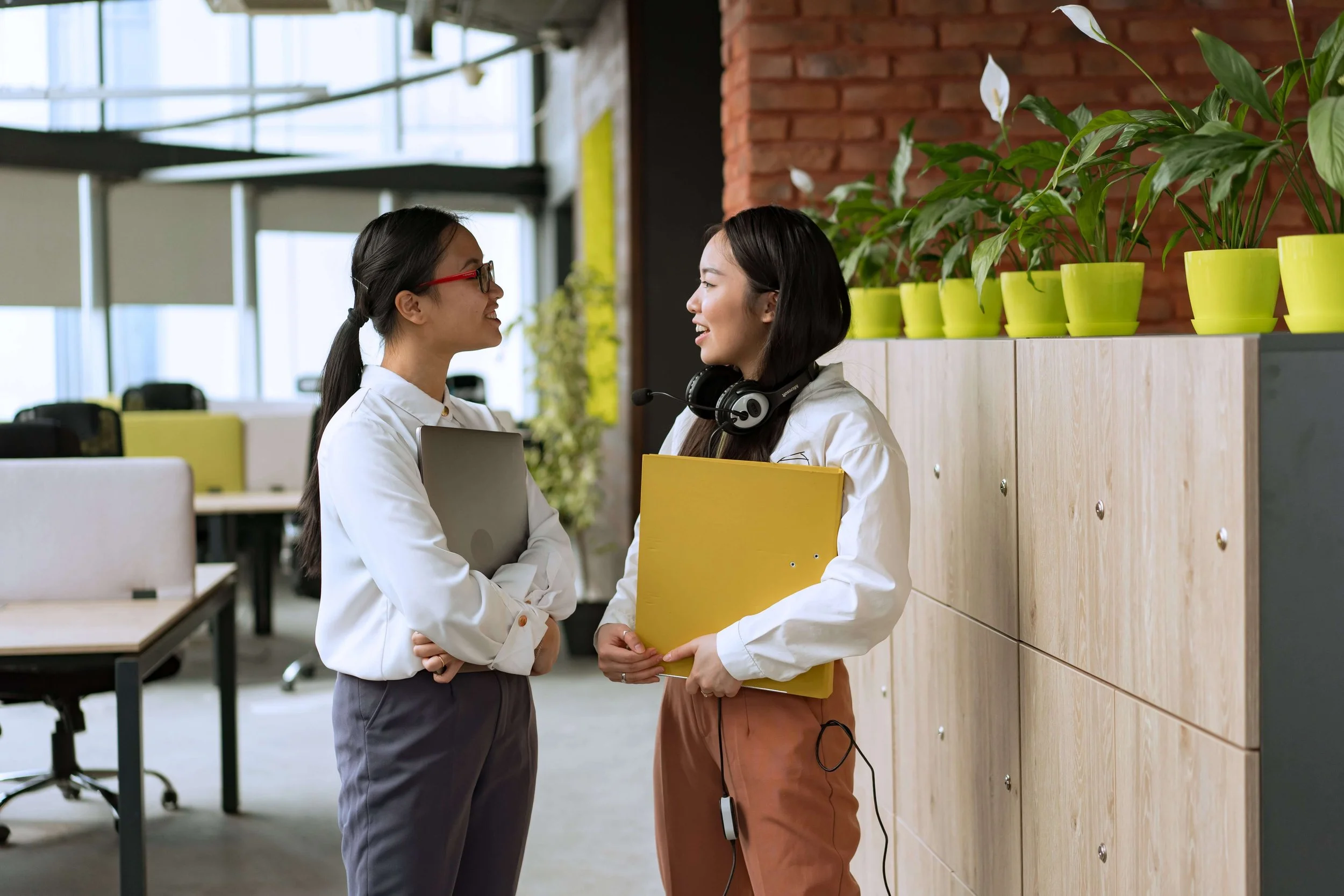 Two women talking together in an office