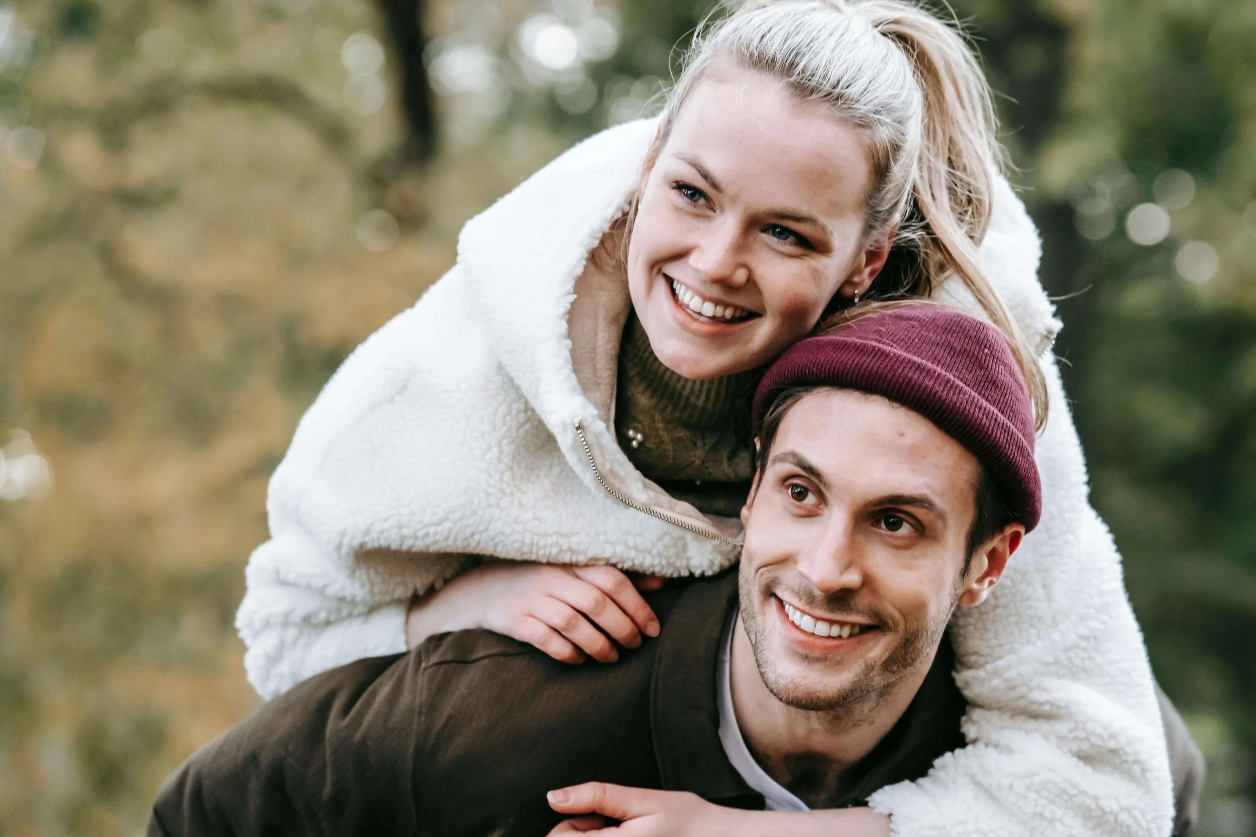A couple smiling together outdoors