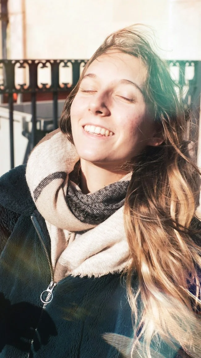 woman smiling in warm natural light