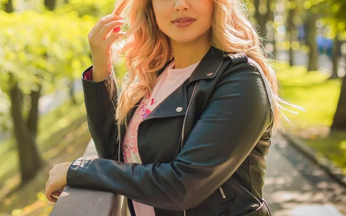 A woman standing in a park