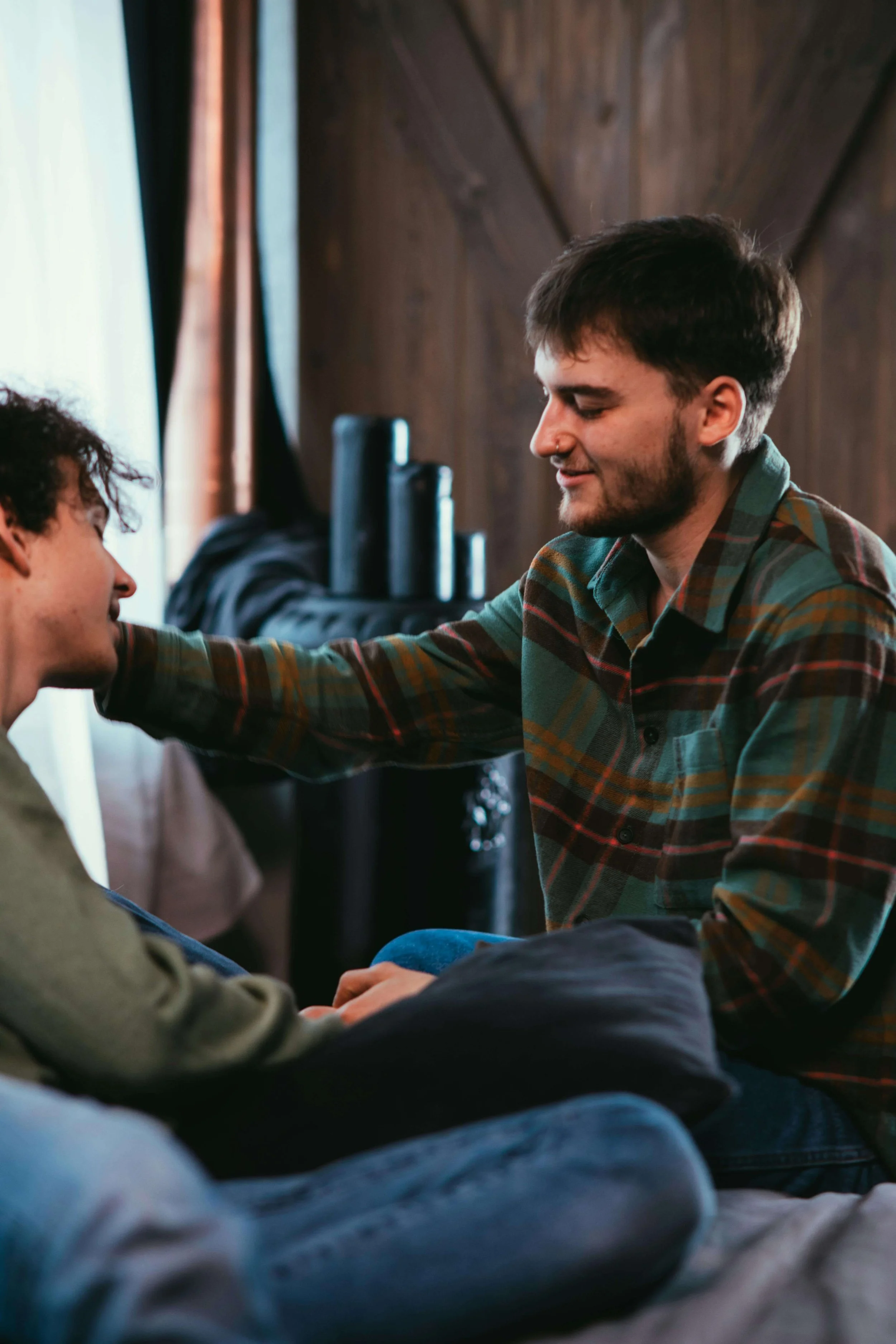 Two men talking together at home