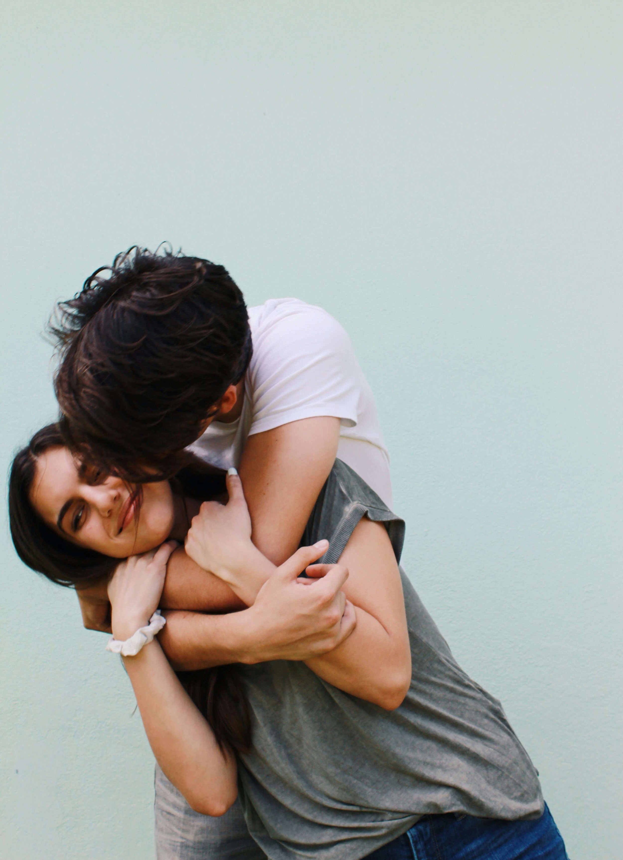 A couple embracing and smiling together