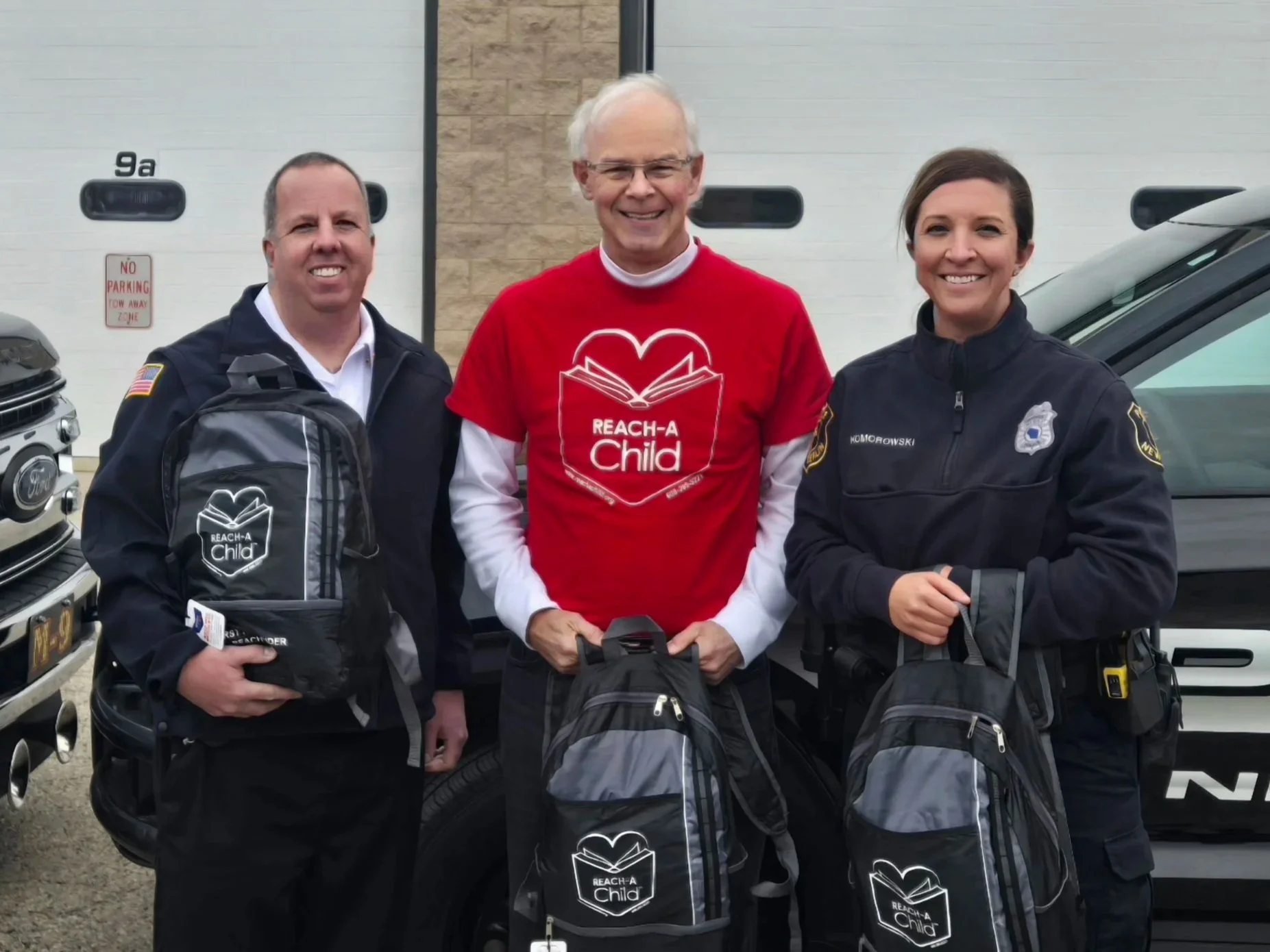 REACH-A-Child Delivered REACH BAGs New Berlin Police and Fire Departments