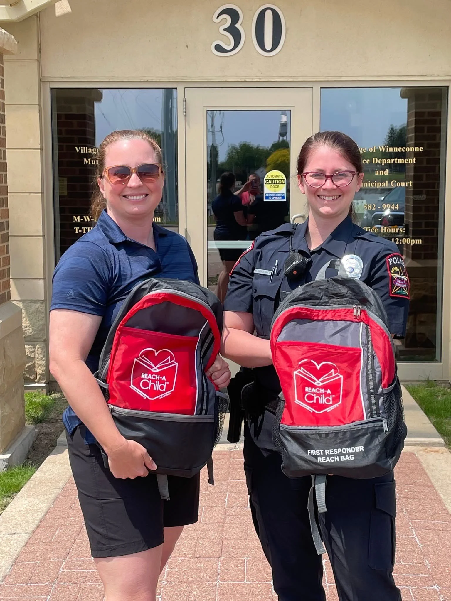 REACH-A-Child Delivers REACH BAGs to the Winneconne Police Department