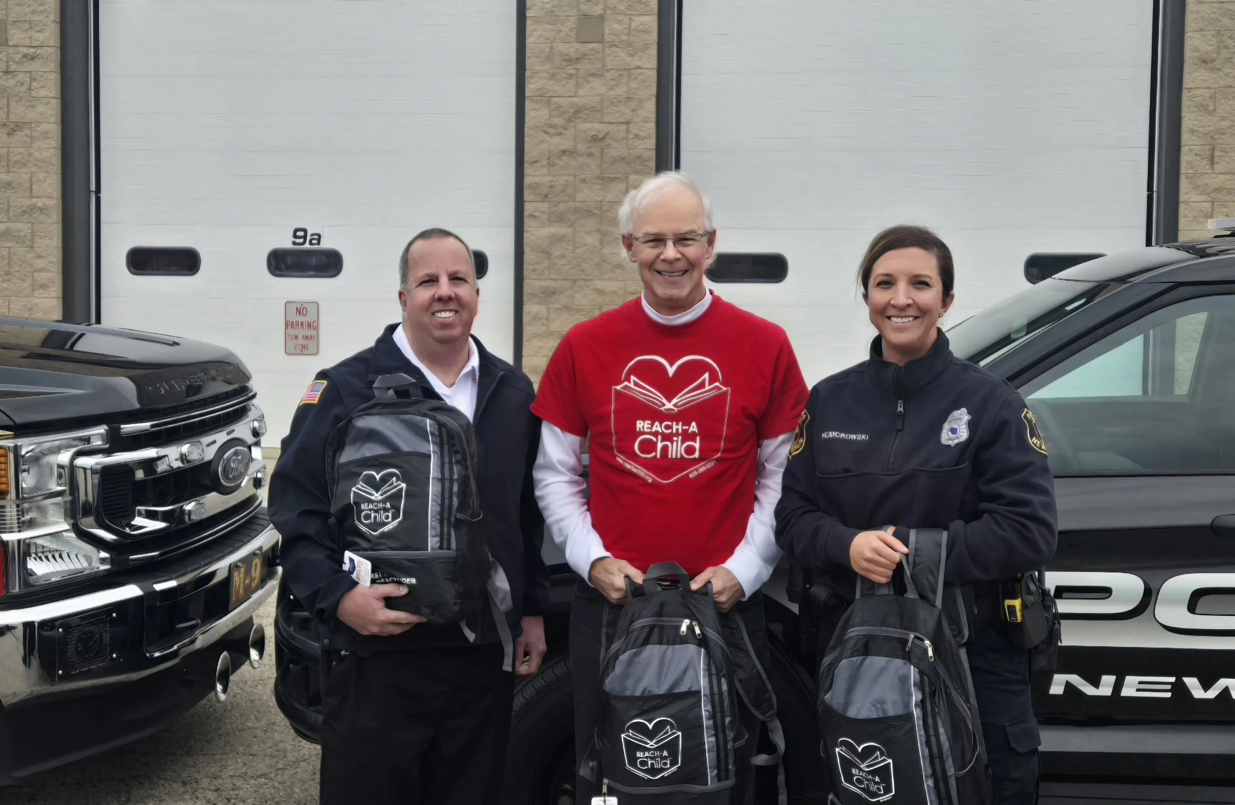 REACH-A-Child Delivered REACH BAGs New Berlin Police and Fire Departments