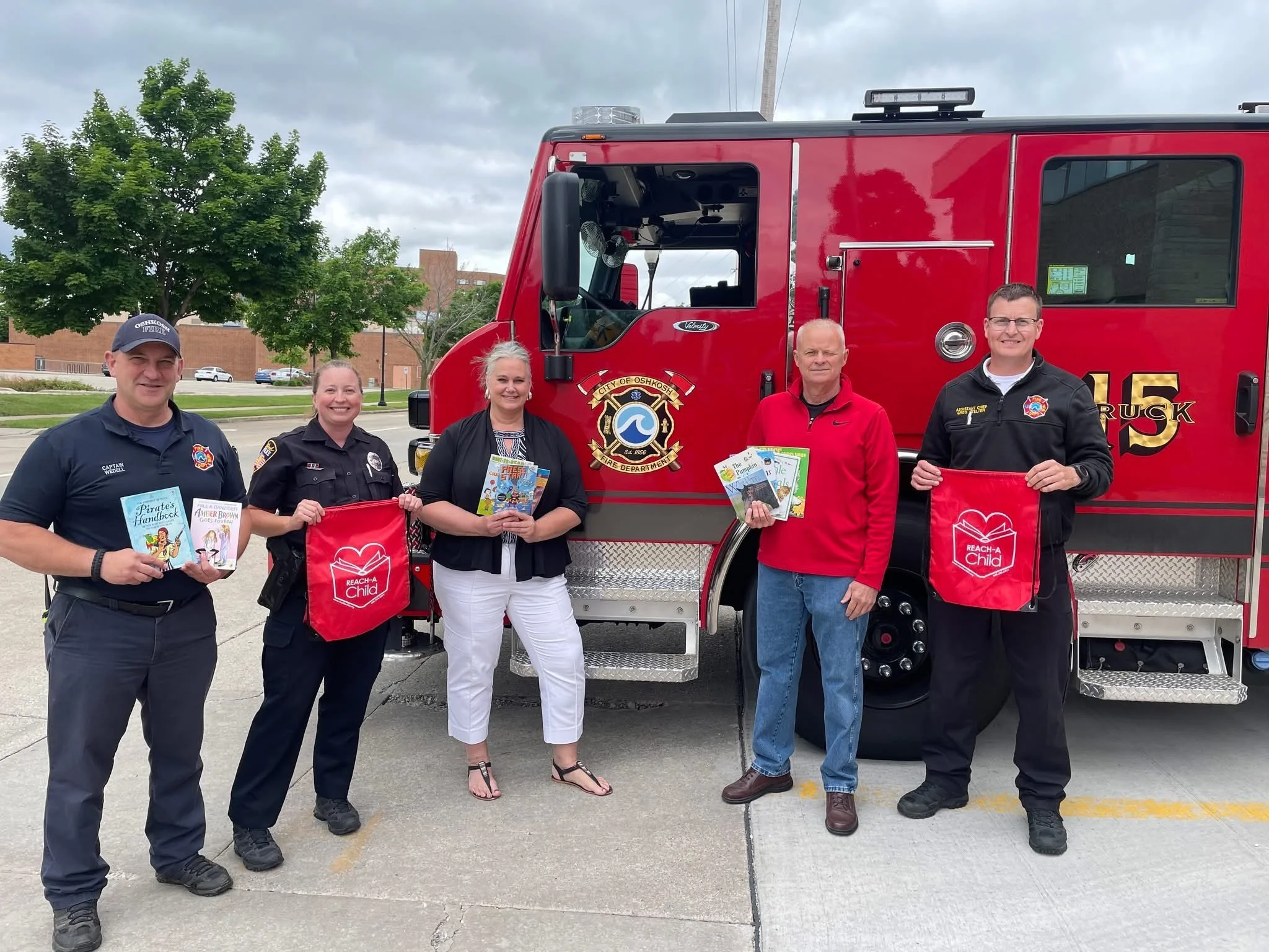 REACH-A-Child Delivers REACH BAGs to the Oshkosh Police and Fire Department