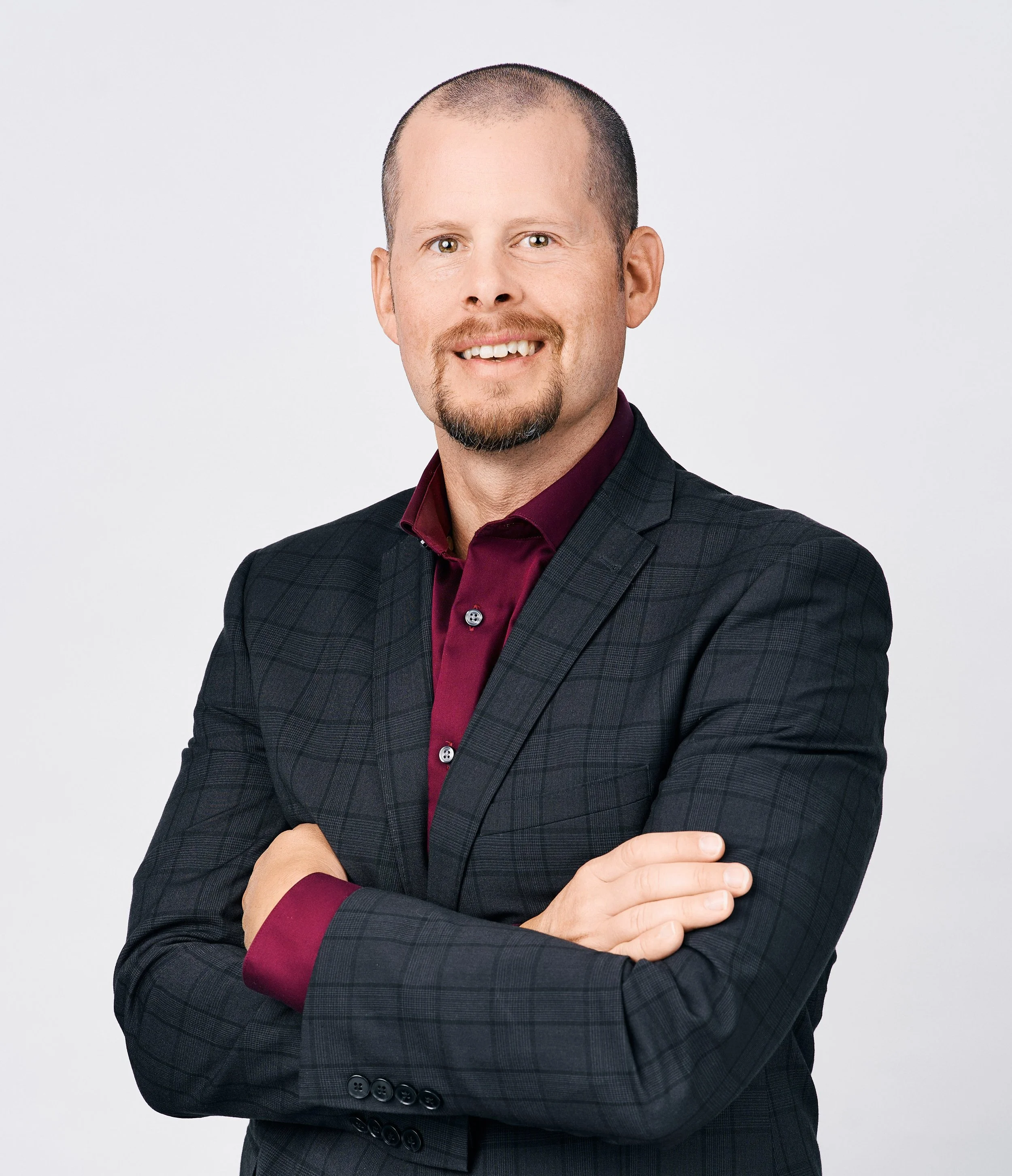 Headshot of Nick Krey in a suit