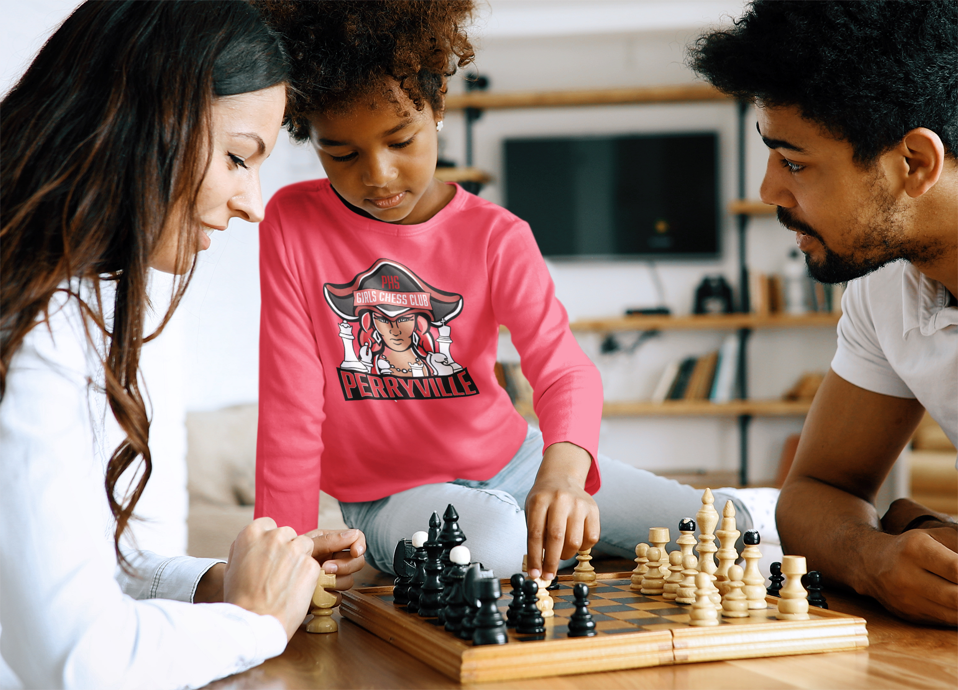 long-sleeve-tee-mockup-of-a-little-girl-playing-chess-with-her-parents-41883-r-el2 (1).png