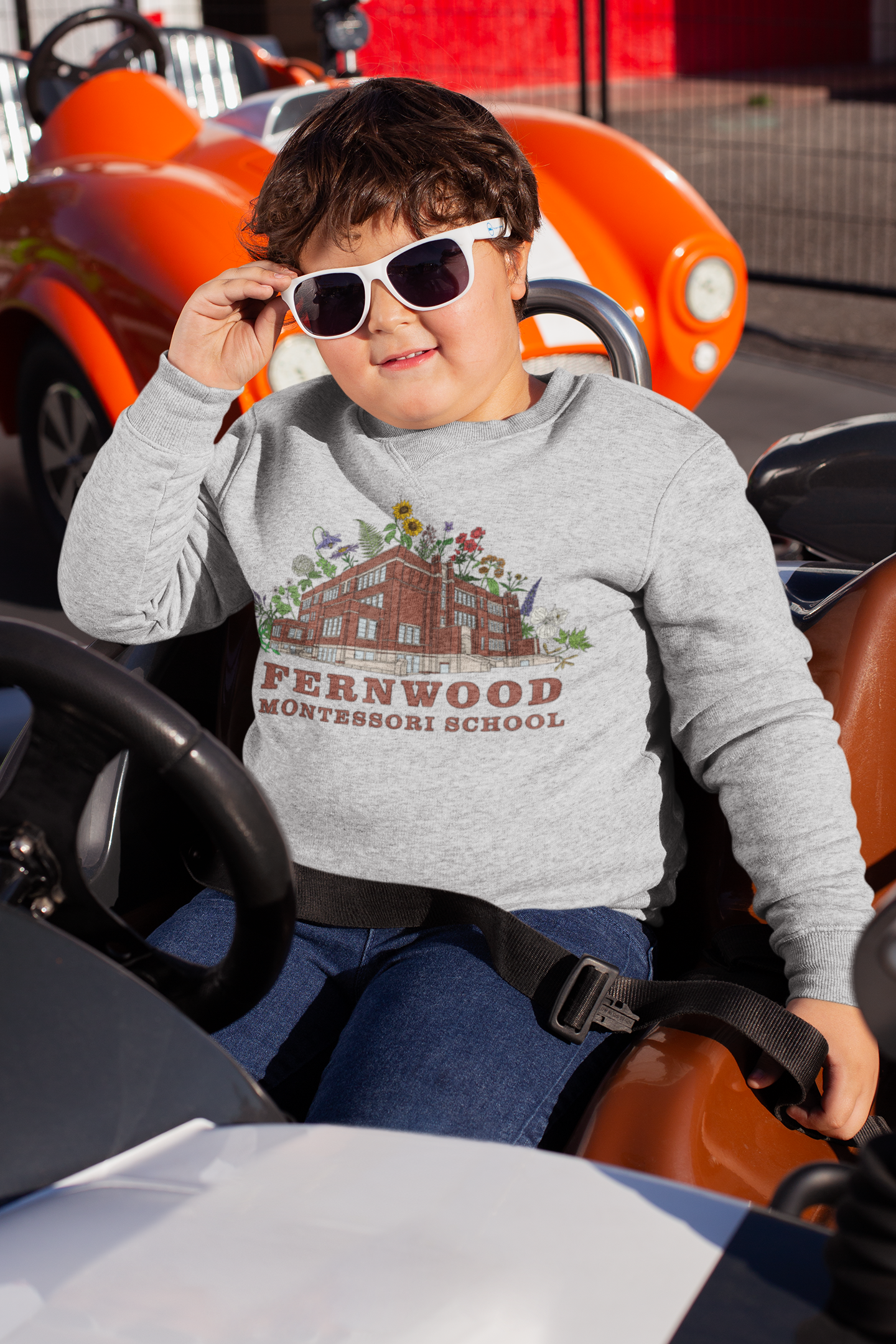 plus-size-crewneck-sweater-mockup-of-a-kid-sitting-in-a-bumper-car-25559.png