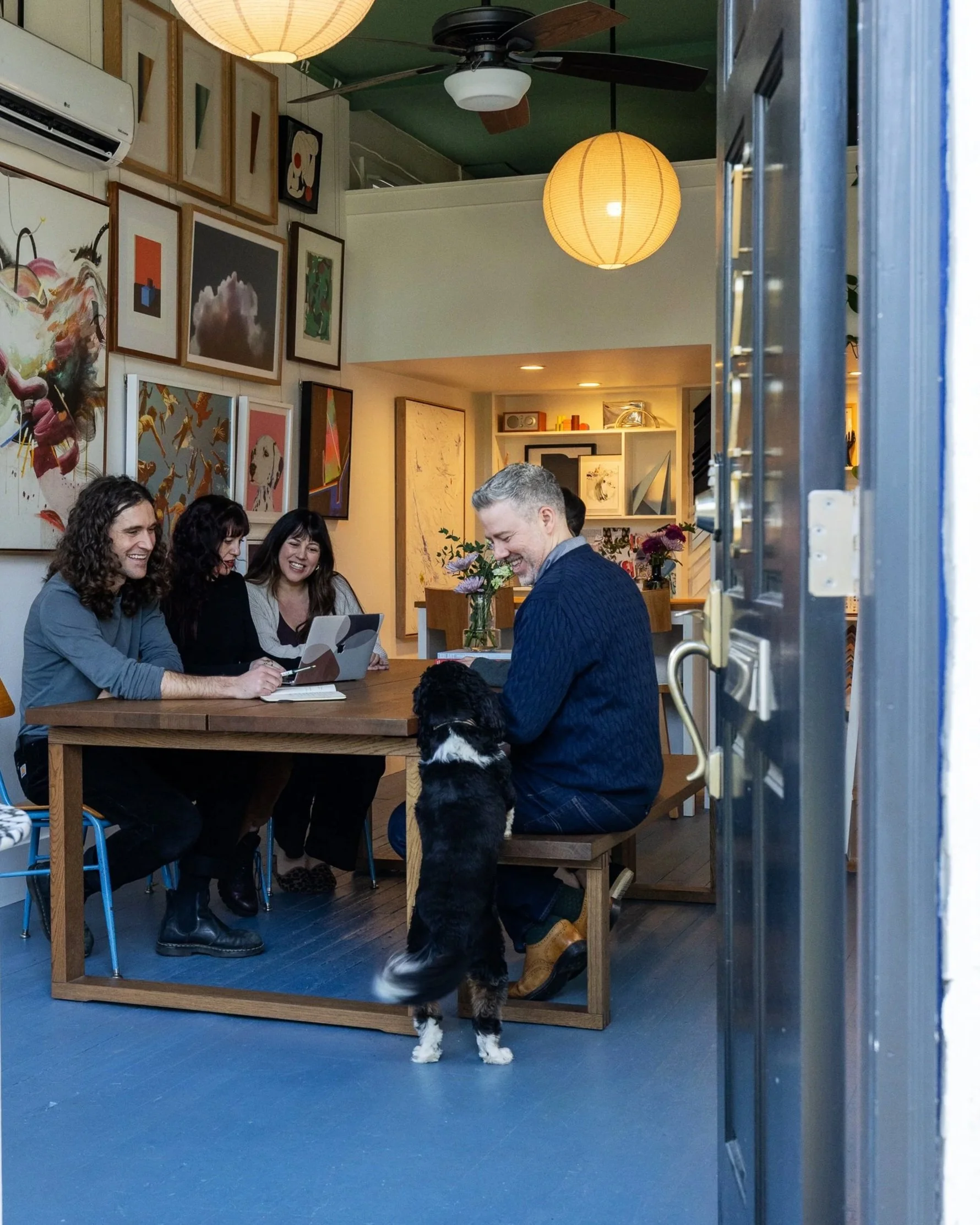 A group of colleagues collaborate on art projects together.